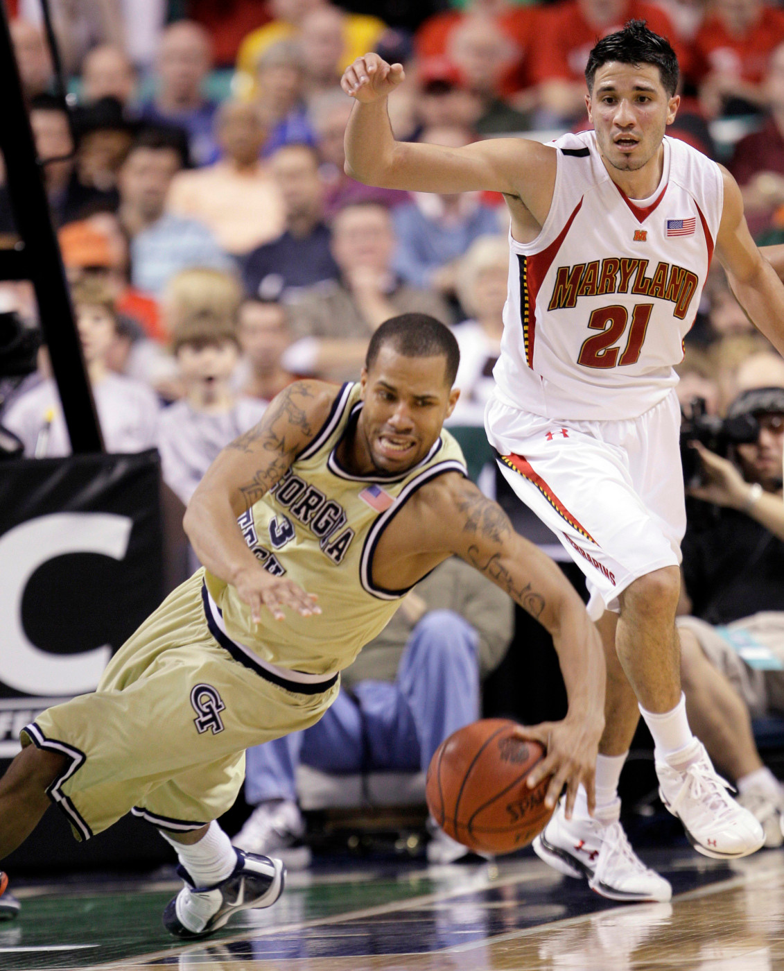 Georgia Tech's Maurice Miller (3) looses his footing as Greivis Vasquez (21) looks on during the first half of an NCAA college basketball game in the Atlantic Coast Conference tournament in Greensboro, N.C., Friday, March 12, 2010. (AP Photo/Gerry Broome)