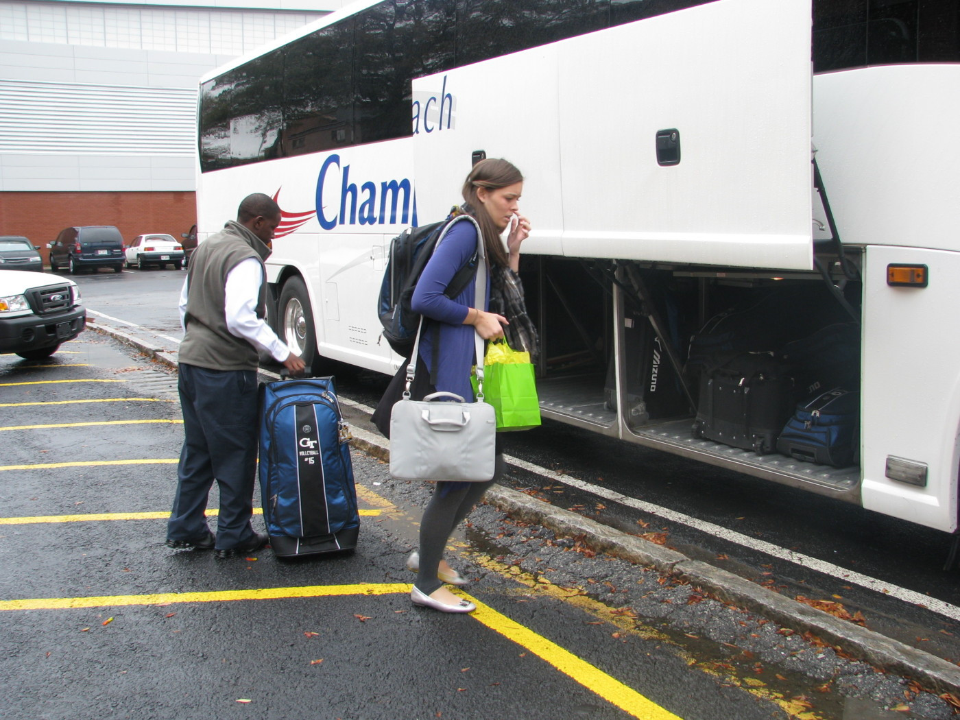 The team loads the bus to head to the airport.