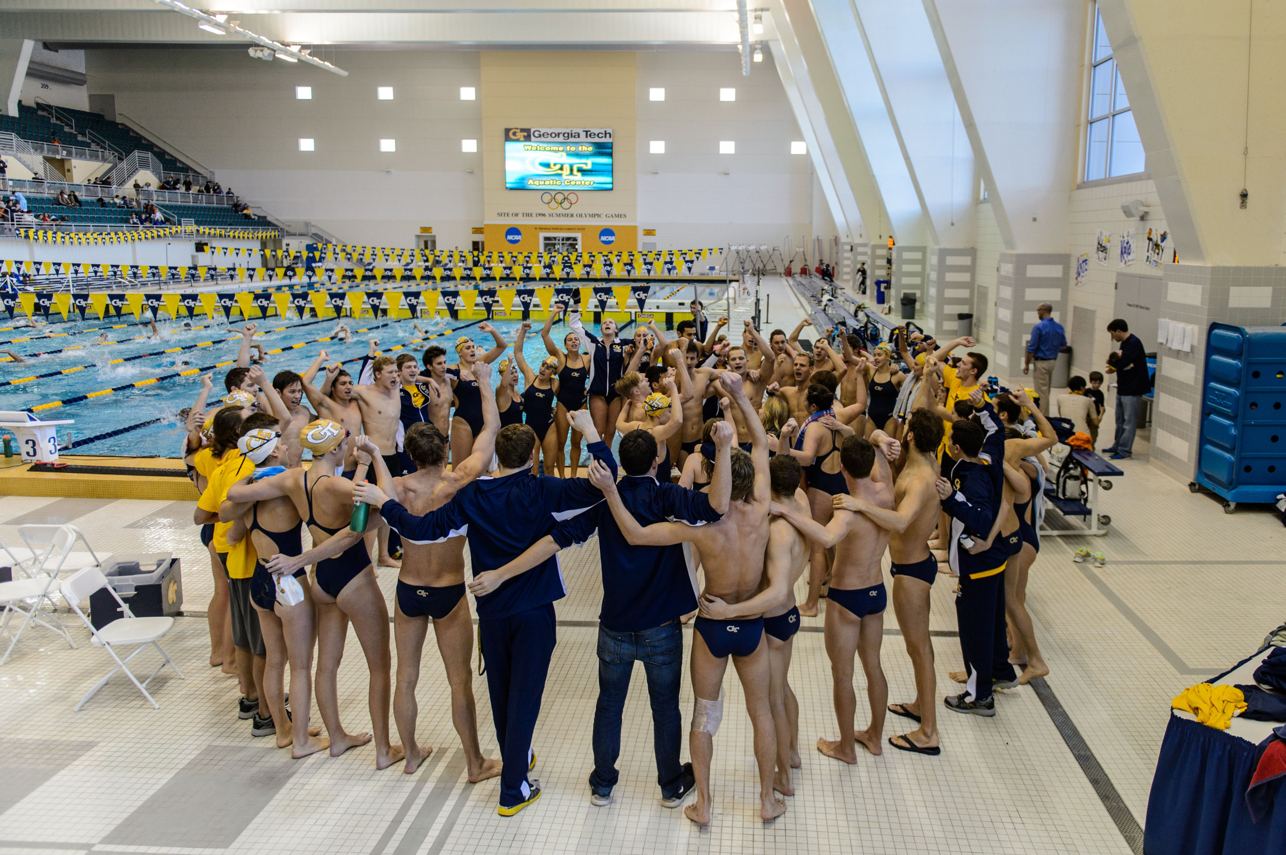 The team sings the fight song after the meet