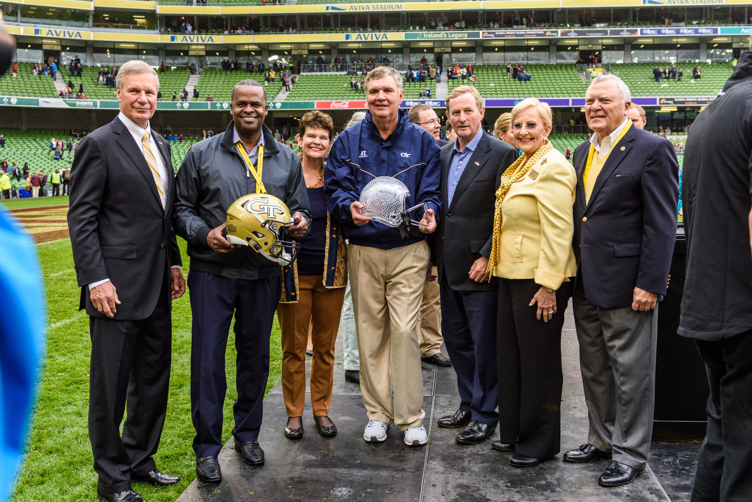Georgia Tech Coach Paul Johnson, Georgia Tech President Bud Peterson and wife, Val, Georgia Govenor Nathan Deal and wife, Sandra, Atlanta Mayor Kasim Reed, and the U.S. Ambassador to Ireland pose for a photo after an NCAA football game, Saturday, Sept. 3, 2016, in Dublin, Ireland. (Danny Karnik/Georgia Tech via AP)