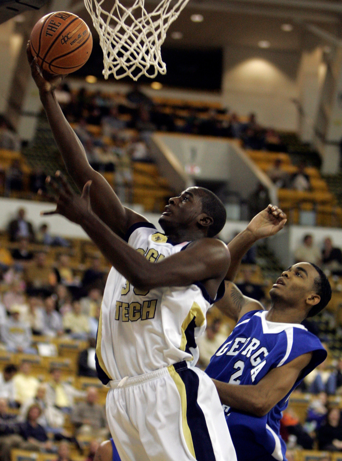 Zach Peacock (35) drives to the basket as Georgia State's Lance Perique (2) defends in the first half. (AP Photo/John Bazemore)