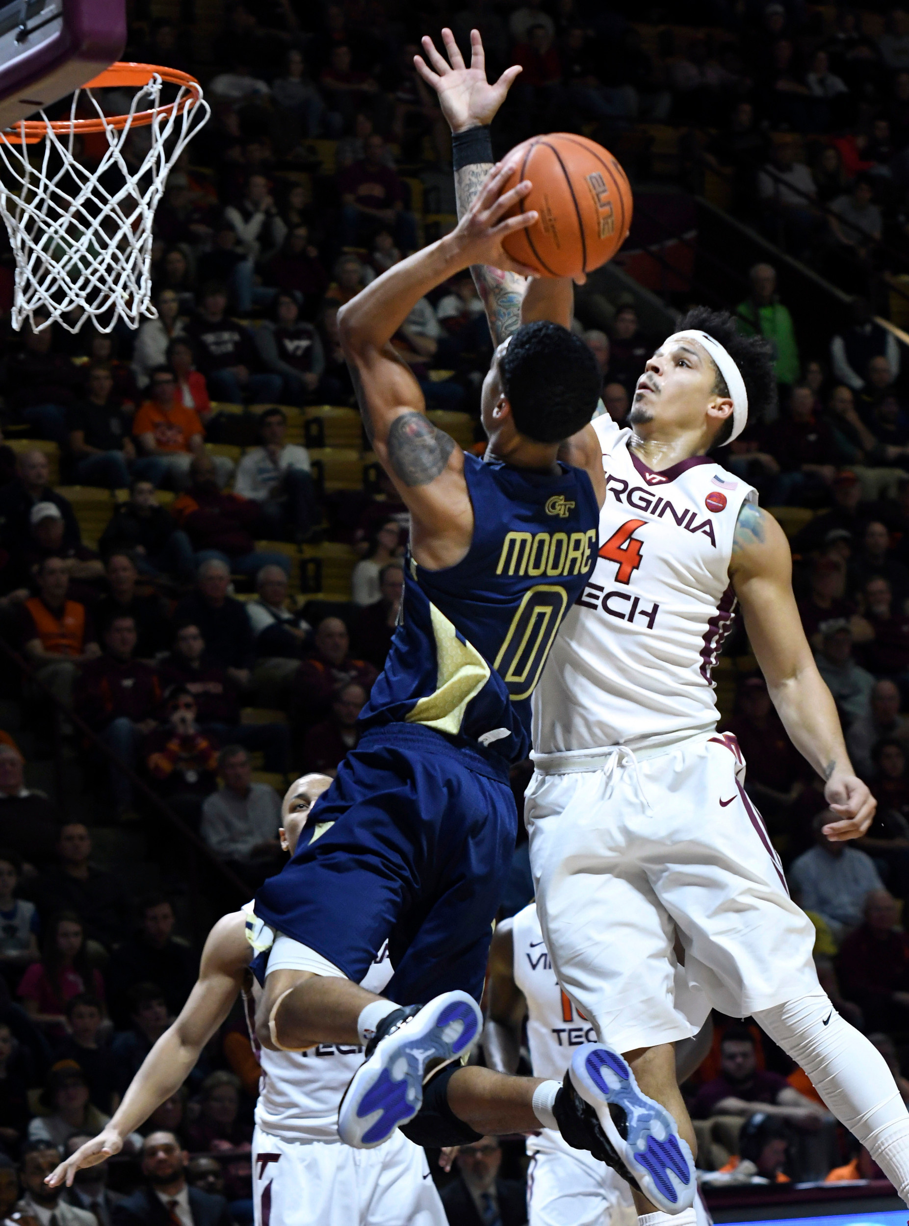 Georgia Tech Yellow Jackets guard Justin Moore (0) shoots while being defended by Virginia Tech Hokies guard Seth Allen (4) in the first half at Cassell Coliseum. Michael Shroyer-USA TODAY Sports