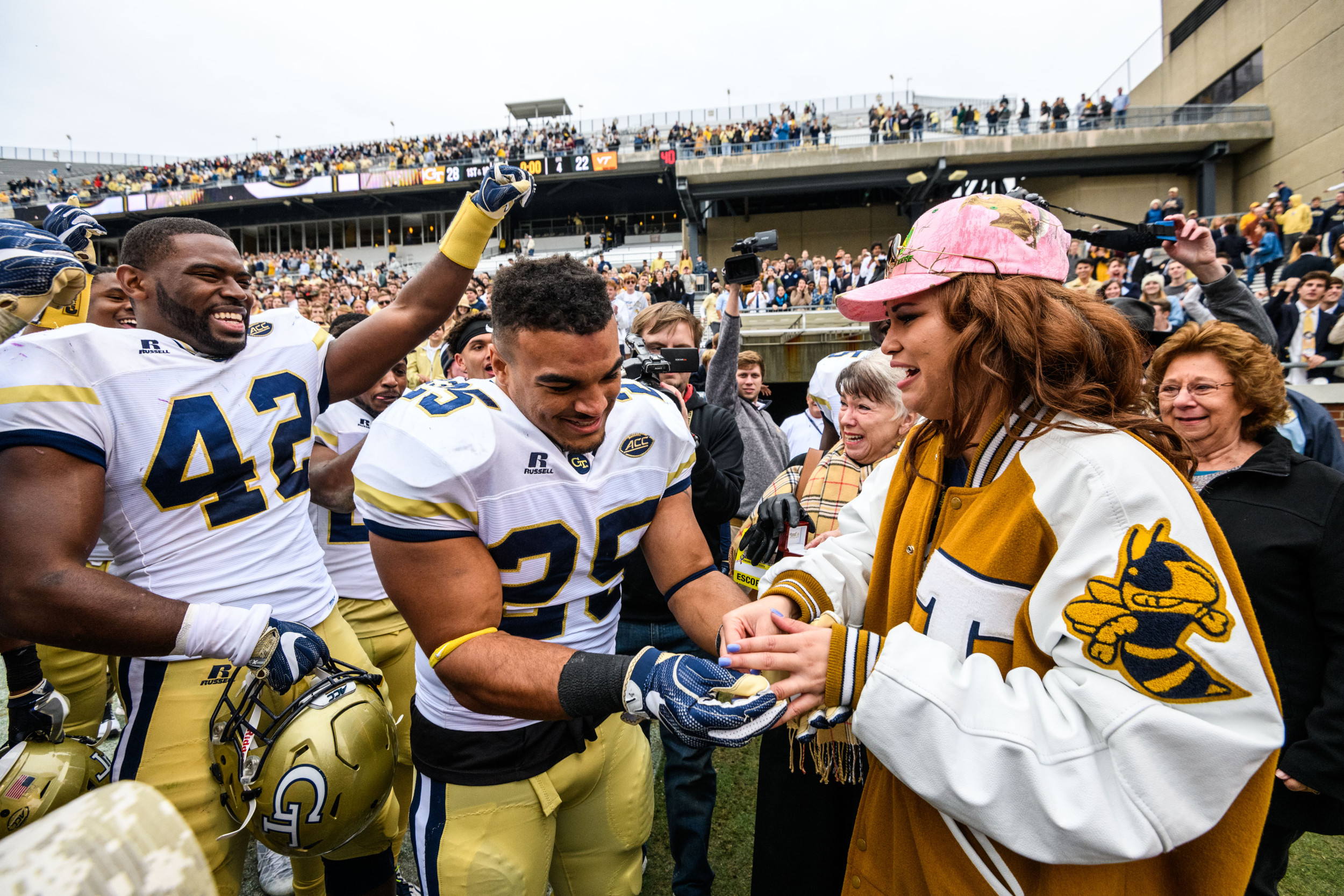 Linebacker Tre' Jackson (25) proposed to his girlfriend, Desiree', after the win. She said yes!