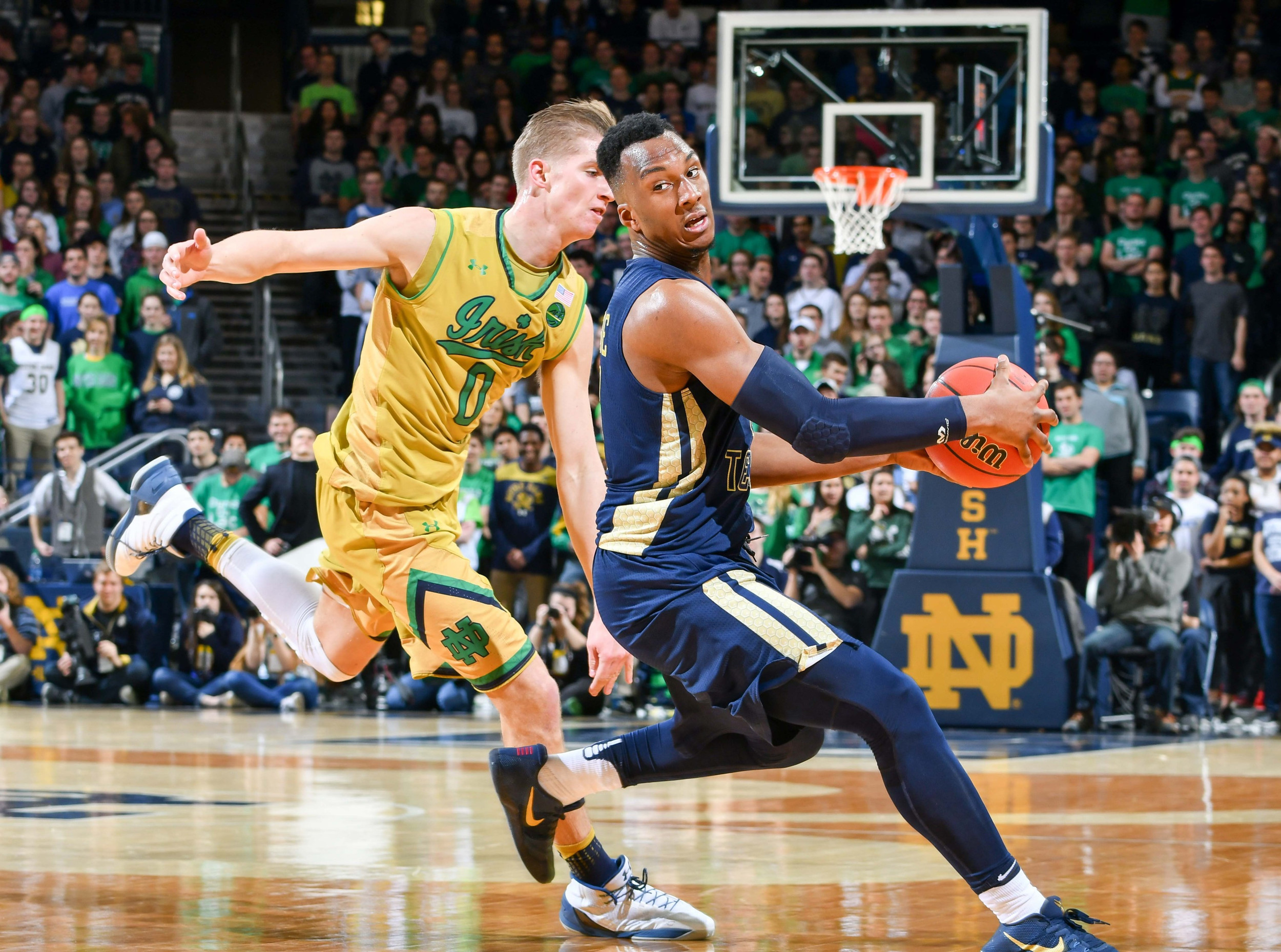 Georgia Tech Yellow Jackets guard Josh Okogie (5) dribbles as Notre Dame Fighting Irish guard Rex Pflueger (0) defends in the first half at the Purcell Pavilion. (Matt Cashore-USA TODAY Sports)