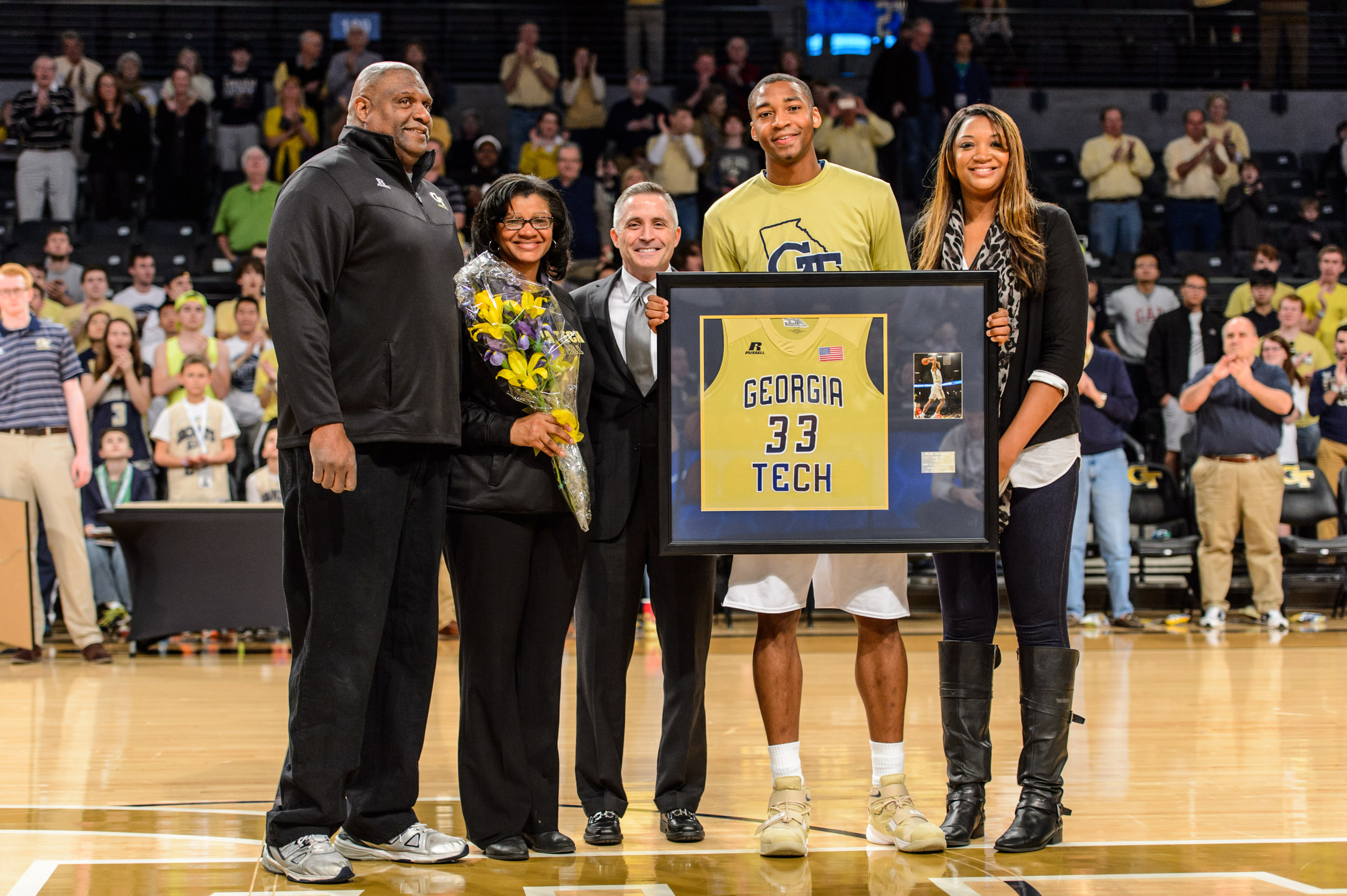 Coach Brian Gregory, Nick Jacobs (32) and family