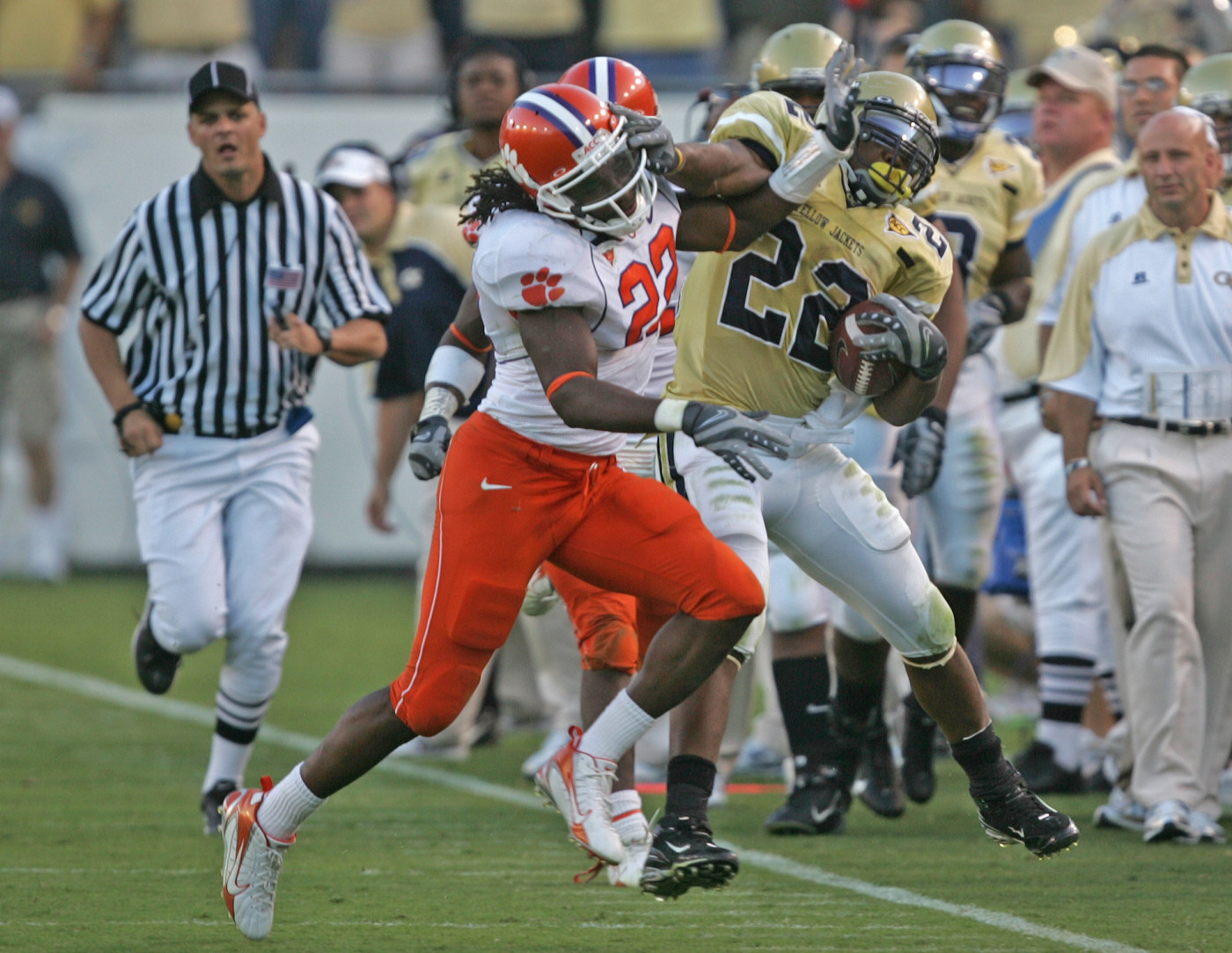 Georgia Tech's Tashard Choice, right, tries to fend off Clemson's Chris Clemons for extra yardage after running for a first down in the fourth quarter. (AP Photo/John Bazemore)