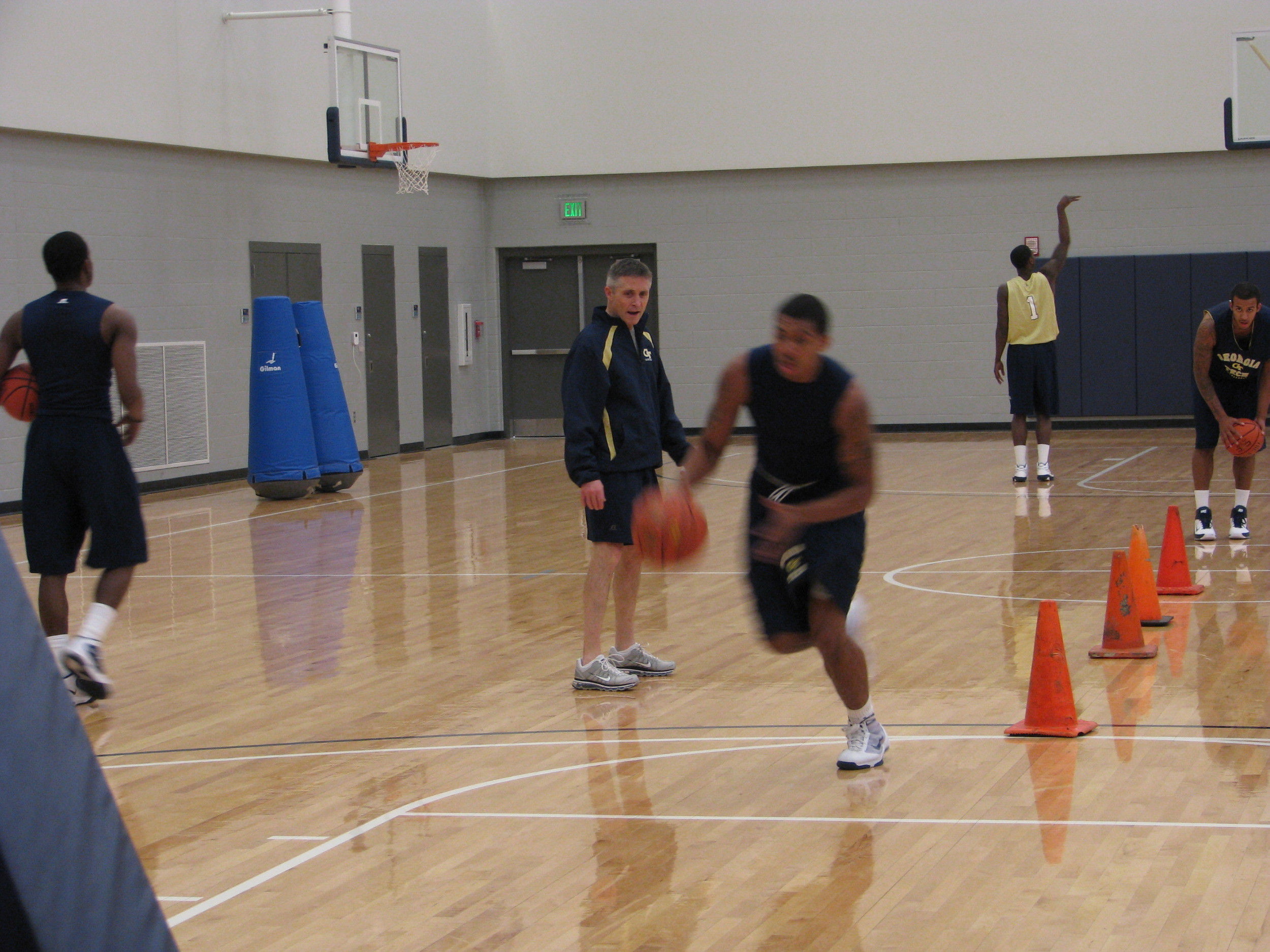 Head coach Brian Gregory puts the Yellow Jackets through individual workouts.