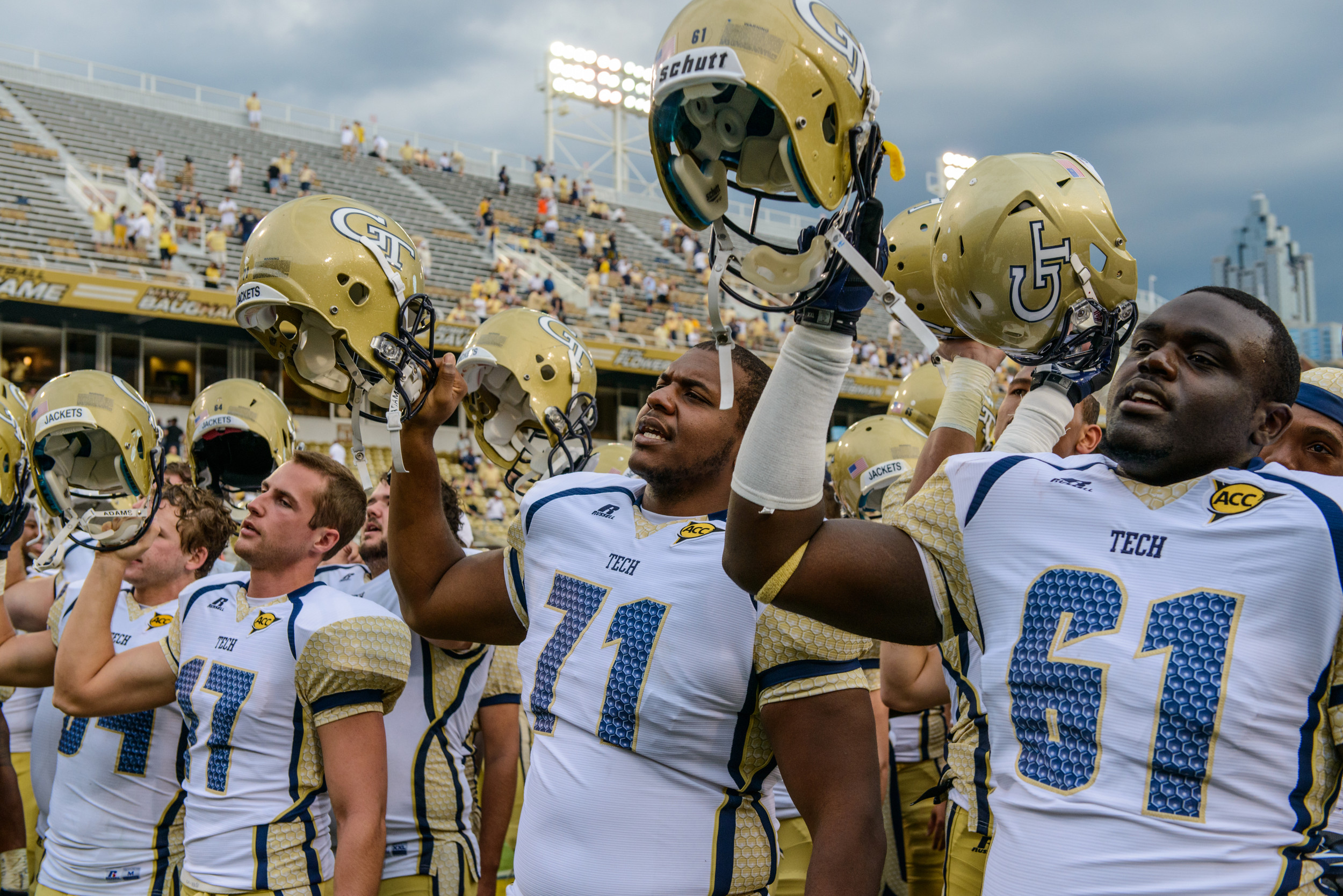 The team sings the fight song after the victory over UVA.