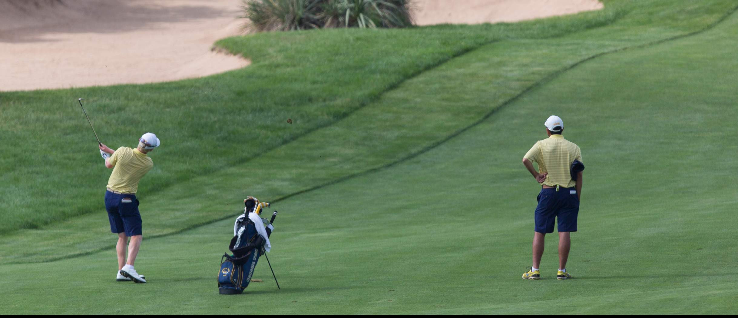 Anders Albertson and assistant coach Brennan Webb at the 2014 NCAA Golf Championship, May 23-28, Prairie Dunes Country Club, Hutchinson, Kan.