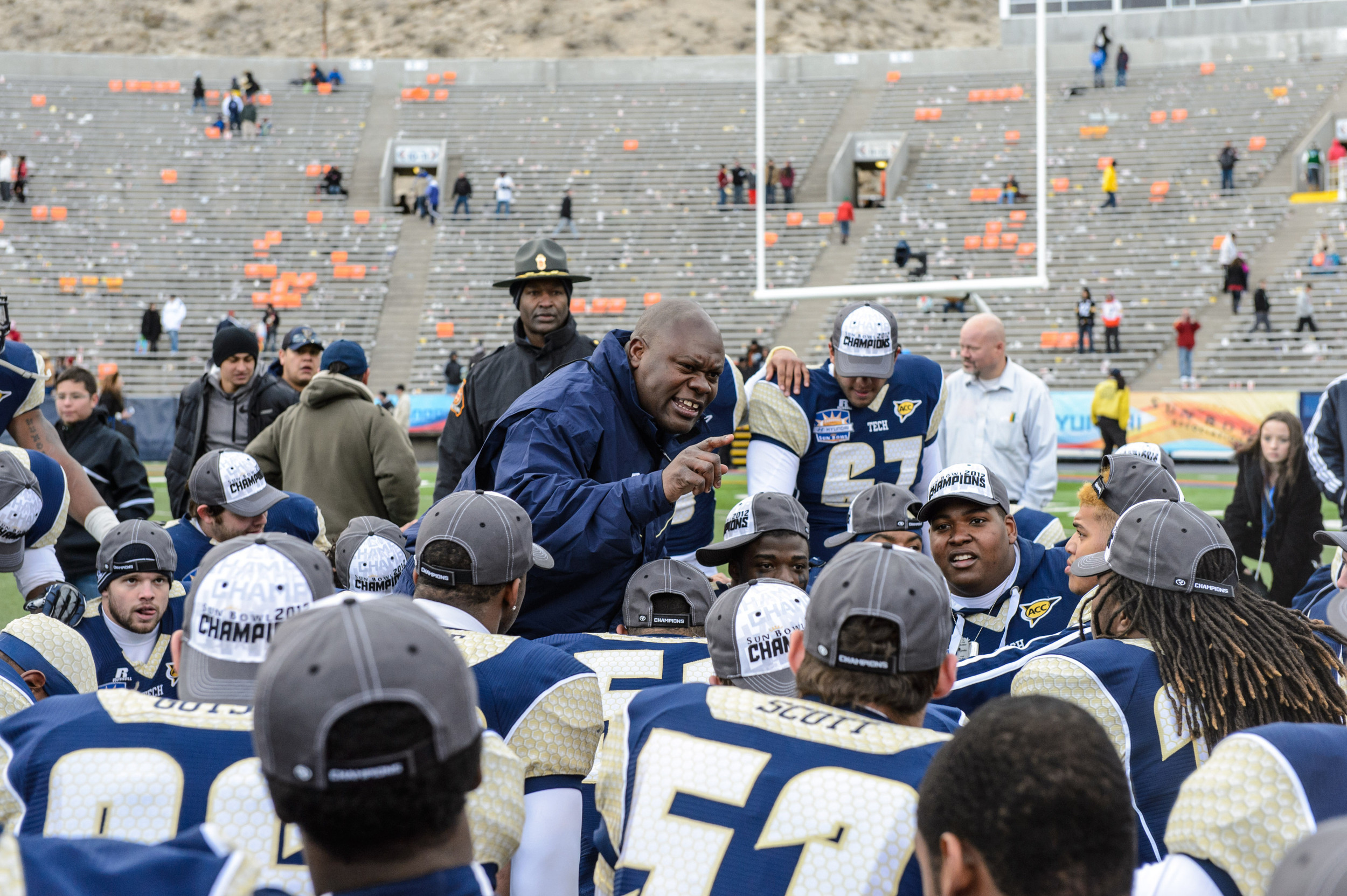 Team Chaplain Derrick Moore speaks to the team after the win.