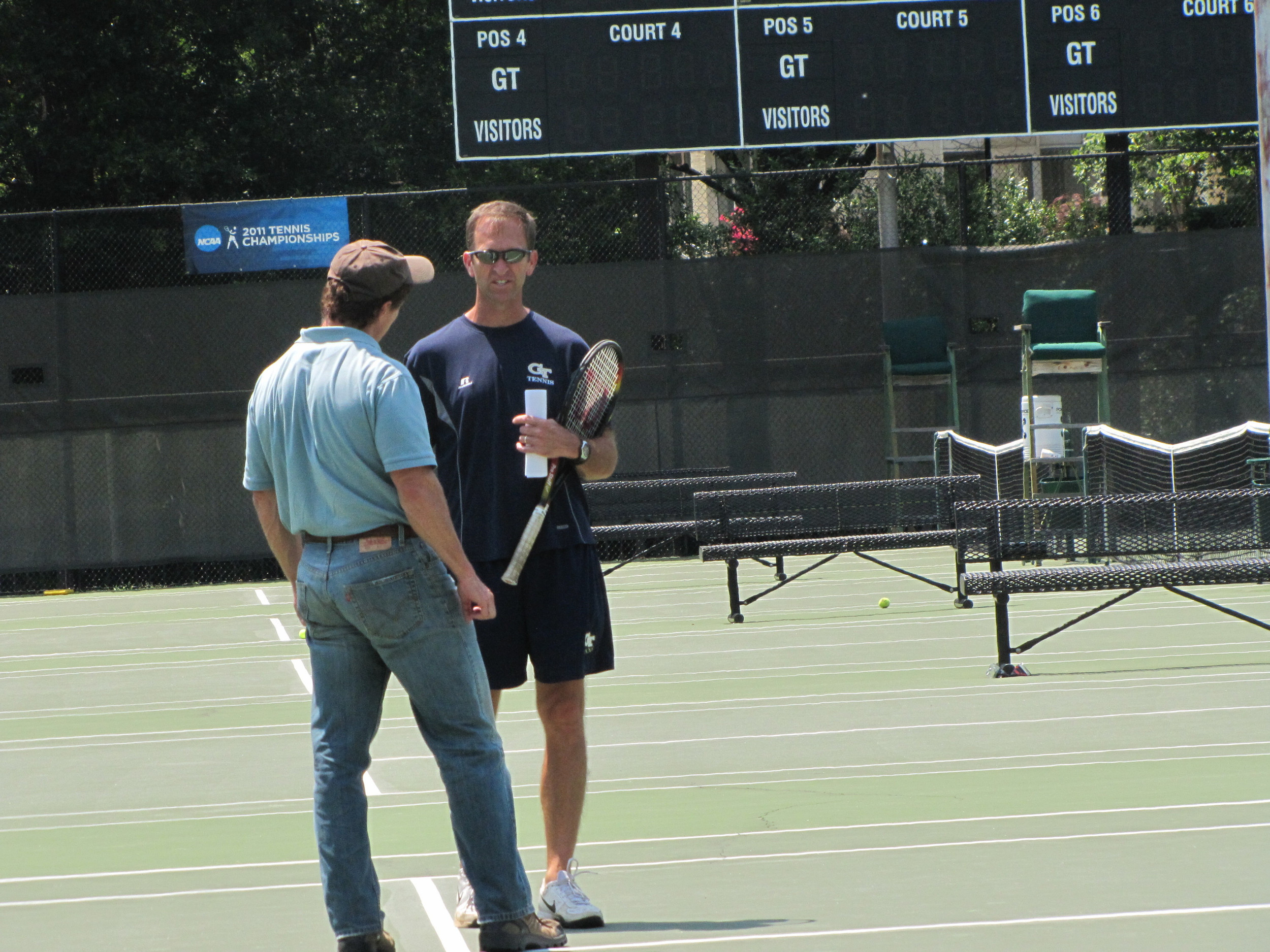 Head coach Kenny Thorne inspects the courts at practice Wednesday, May 11, 2011.