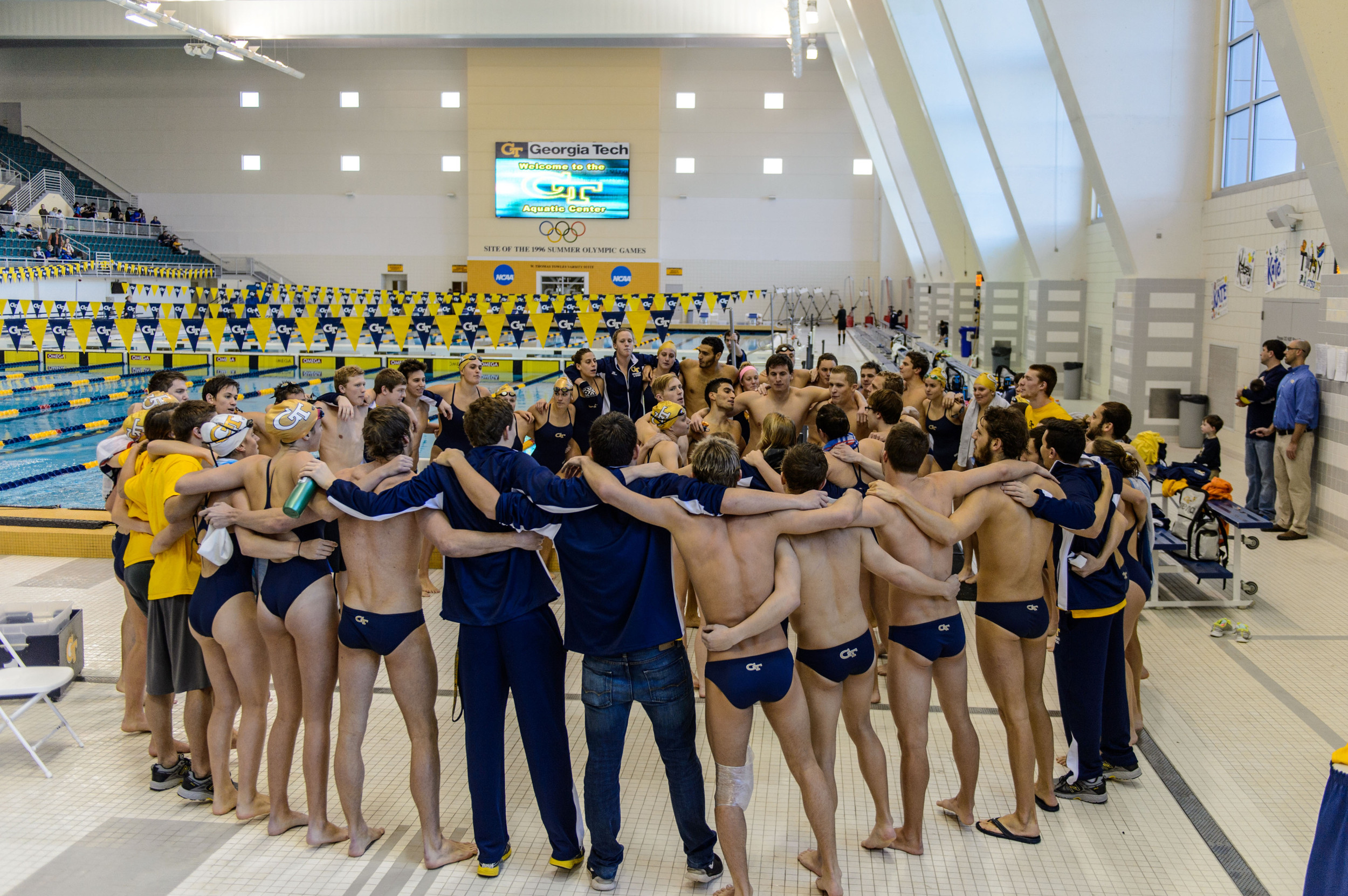 The team sings the fight song after the meet