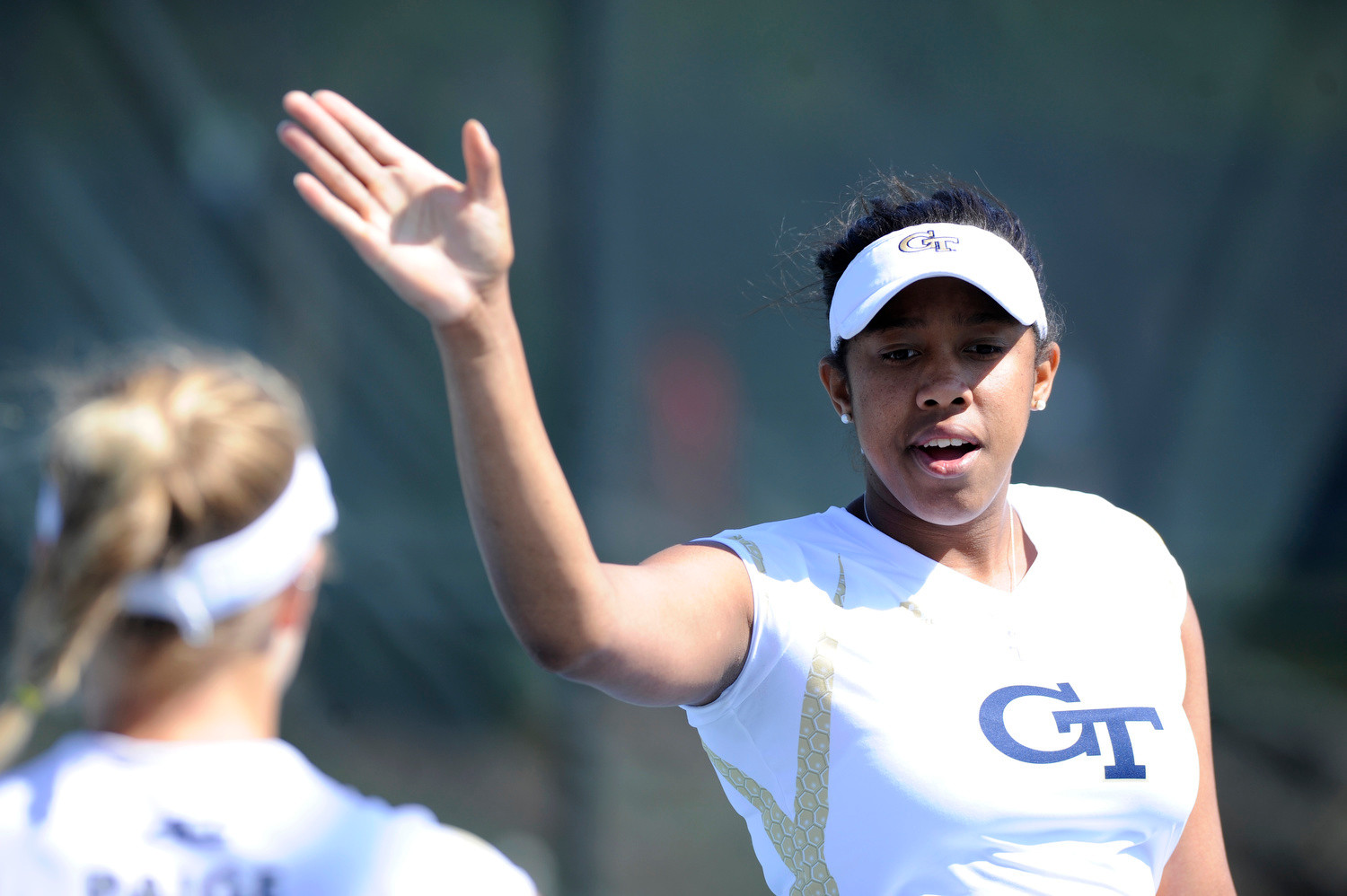 Georgia Tech's Kendal Woodard and Paige Hourigan high five during a doubles match against NC State during the 2015 ACC WomenÕs Tennis Championship match in Cary, N.C., Thursday, April 23, 2015. (Photo by Liz Condo, theACC.com)