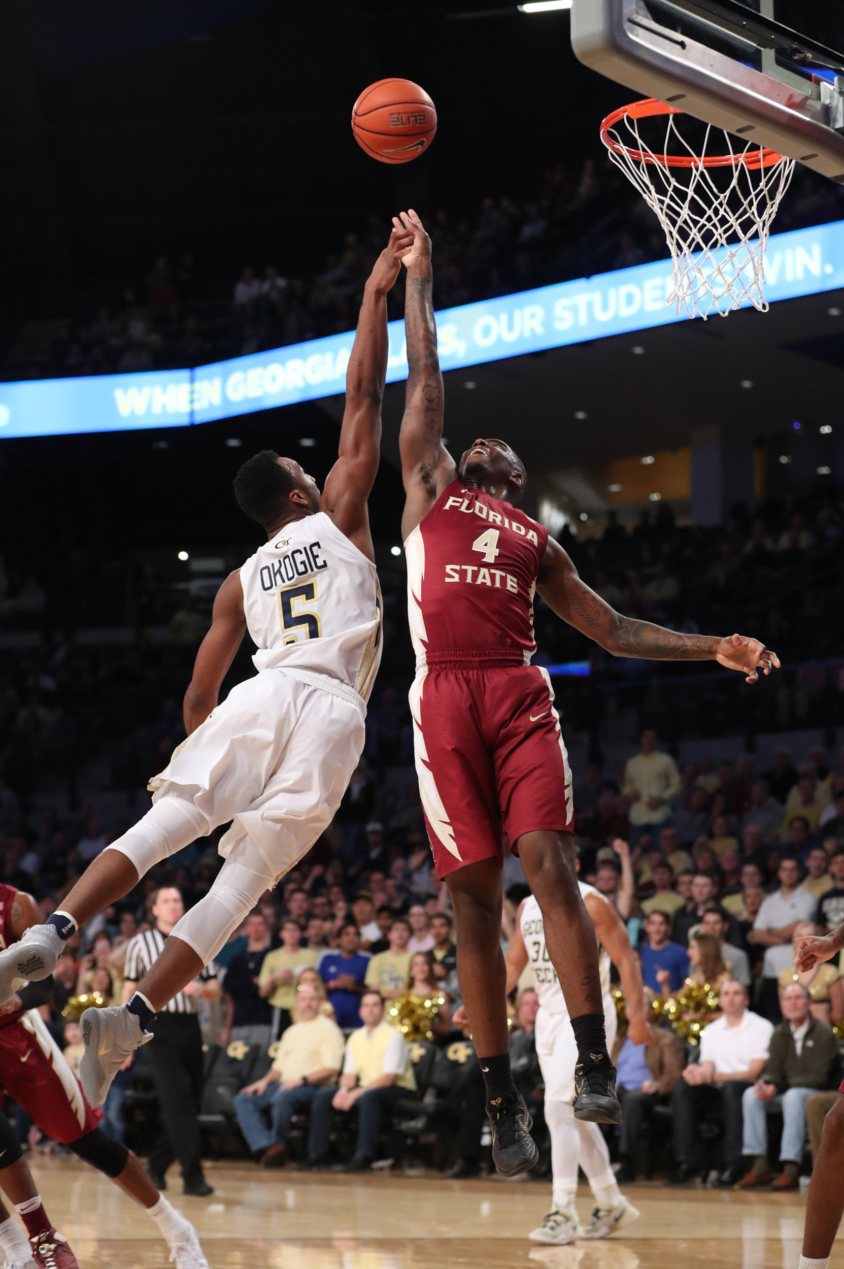 Jan 25, 2017; Josh Okogie (5) and Florida State Seminoles guard Dwayne Bacon (4) battle for a rebound in the first half at McCamish Pavilion. Credit: Jason Getz-USA TODAY Sports