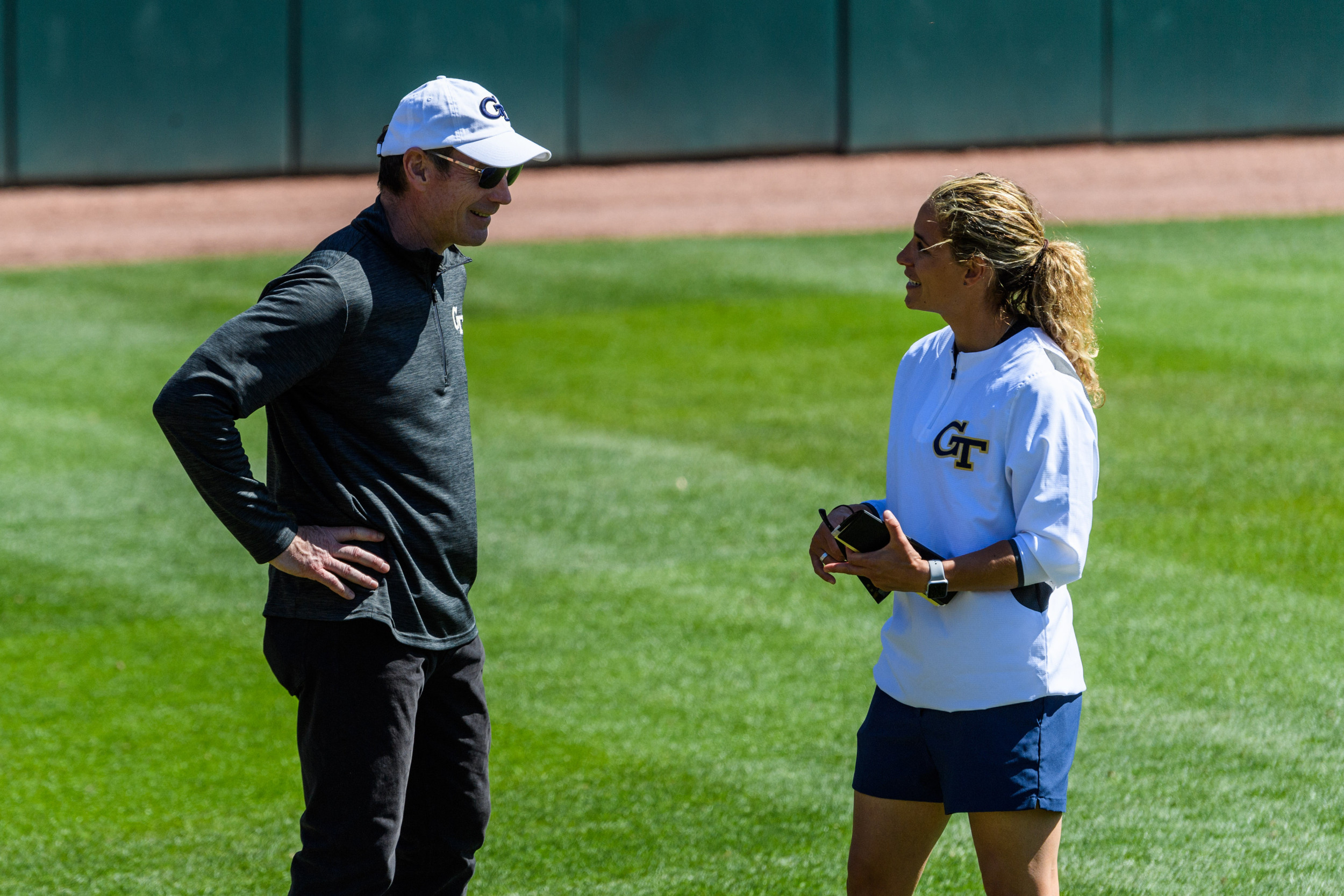 Director of Athletics Todd Stansbury chats with Coach Aileen Morales after the game