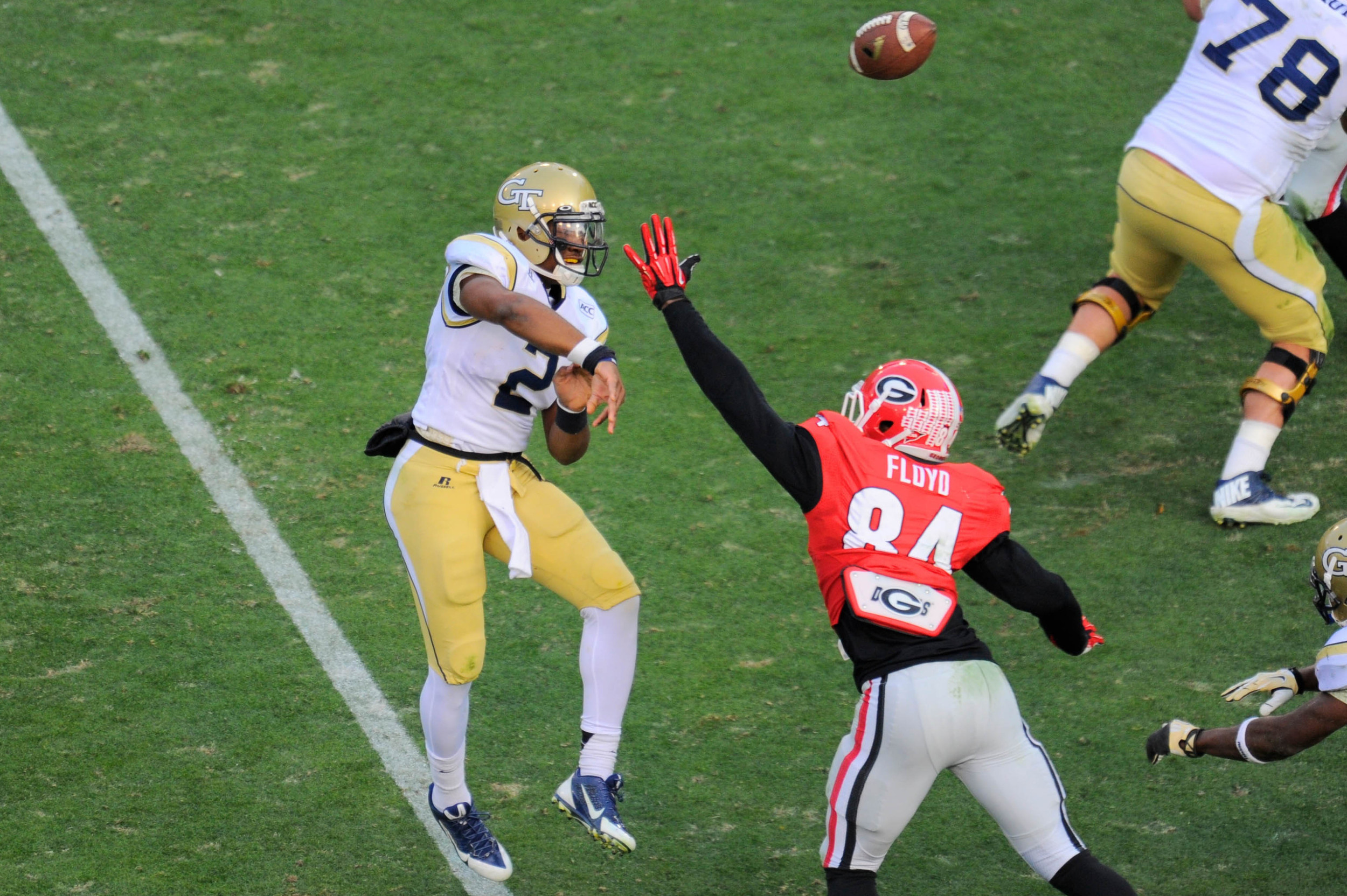 Nov 30, 2013; Atlanta, GA, USA; Georgia Tech Yellow Jackets quarterback Vad Lee (2) passes over Georgia Bulldogs linebacker Leonard Floyd (84) during the second quarter at Bobby Dodd Stadium. Mandatory Credit: Dale Zanine-USA TODAY Sports