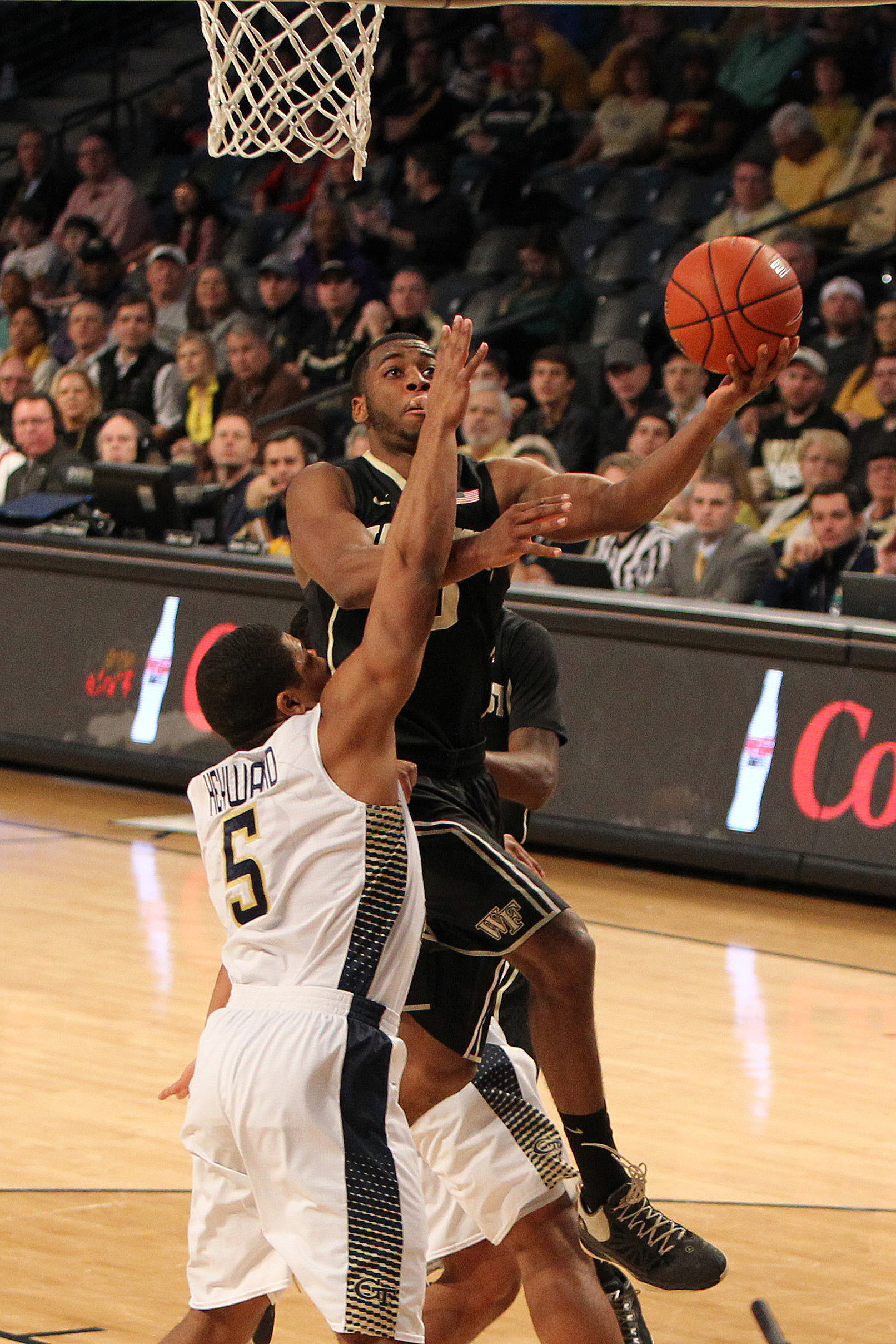 Feb 7, 2015; Atlanta, GA, USA; Wake Forest Demon Deacons guard Codi Miller-McIntyre (0) shoots a lay up against the Georgia Tech Yellow Jackets in the first half at McCamish Pavilion. Mandatory Credit: Brett Davis-USA TODAY Sports
