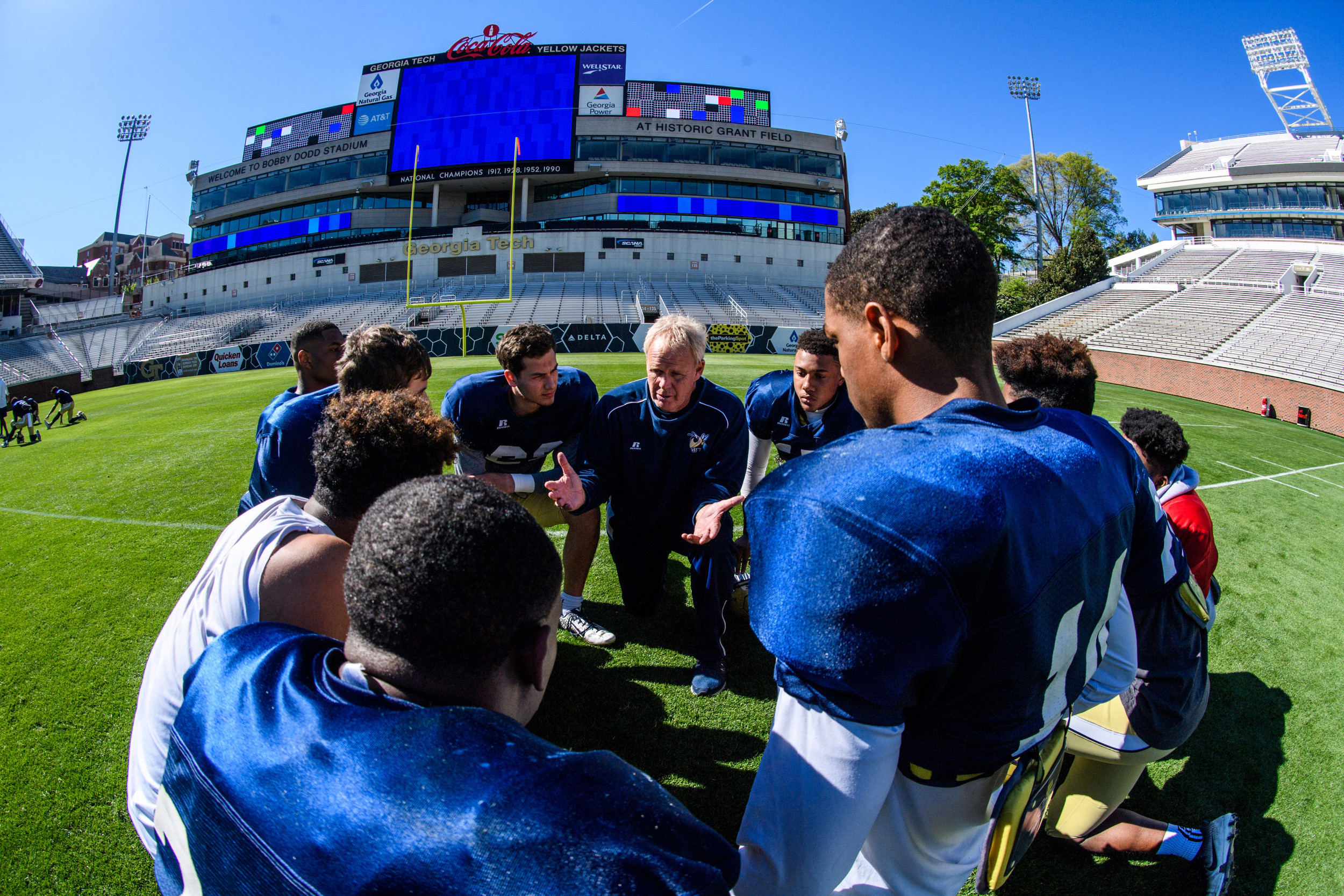 Assistant Coach McCollum talks with the safeties after practice