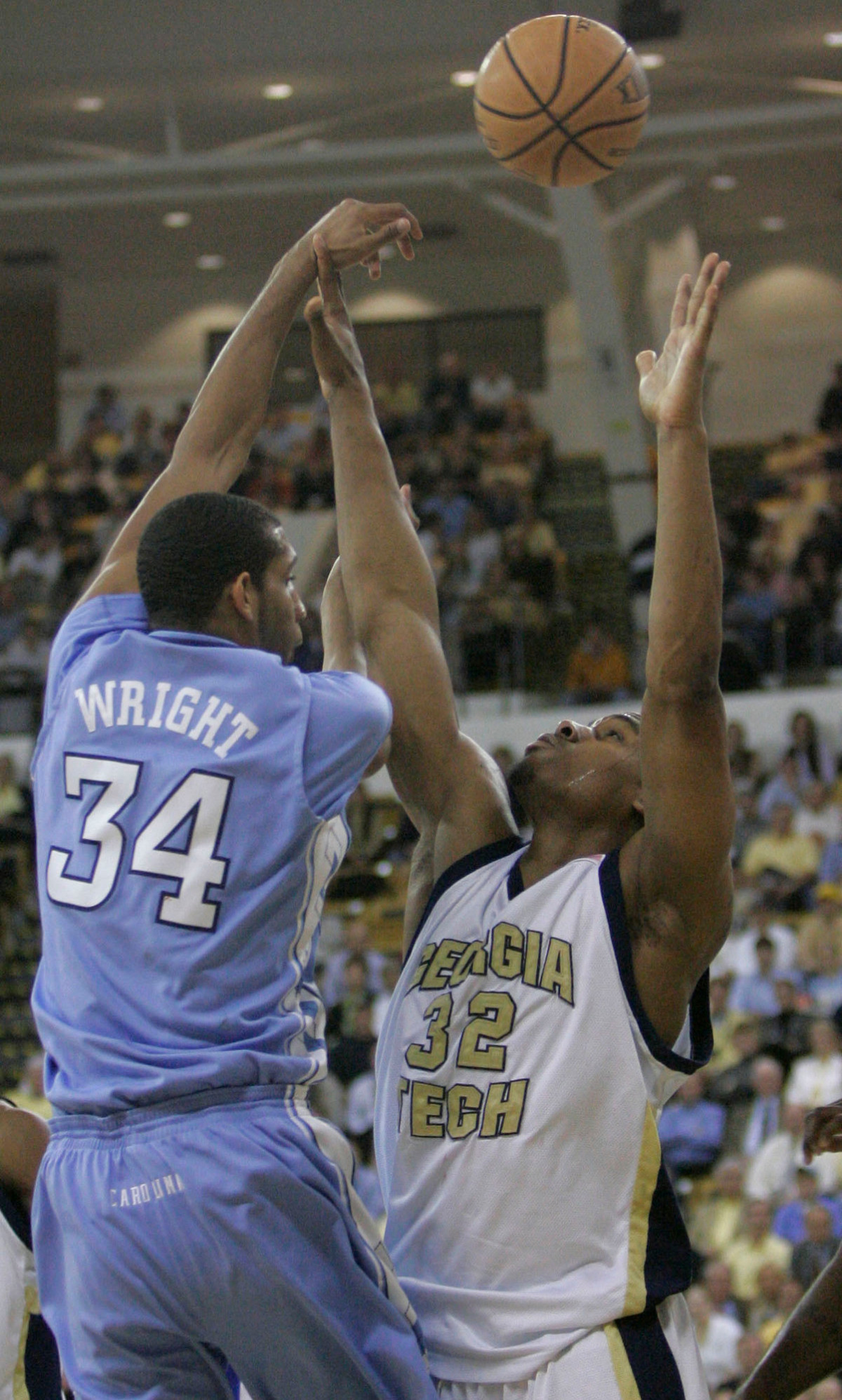 North Carolina forward Brandan Wright passes over Jeremis Smith.