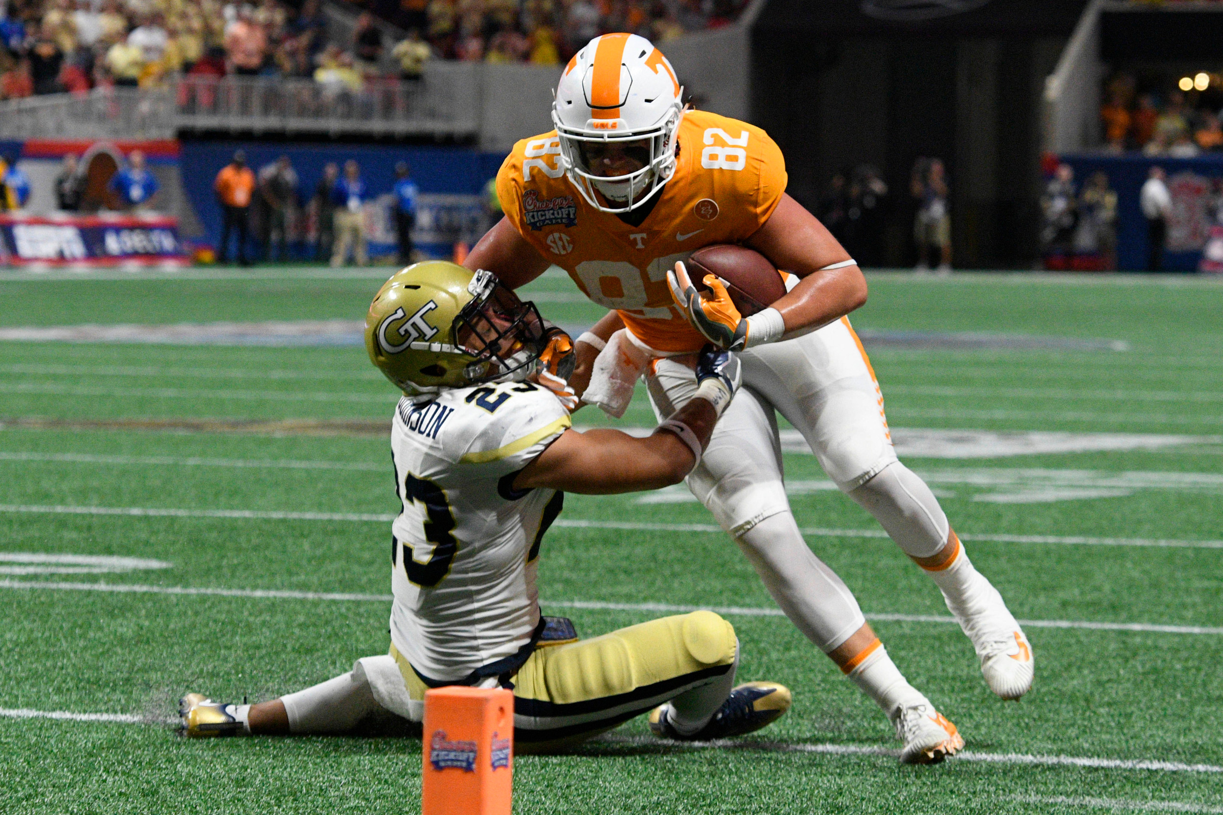 Sep 4, 2017; Atlanta, GA, USA;Georgia Tech Yellow Jackets defensive back Jalen Johnson (23) tackles Tennessee Volunteers tight end Ethan Wolf (82) after a pass reception during the second quarter at Mercedes-Benz Stadium. Mandatory Credit: Dale Zanine-USA TODAY Sports