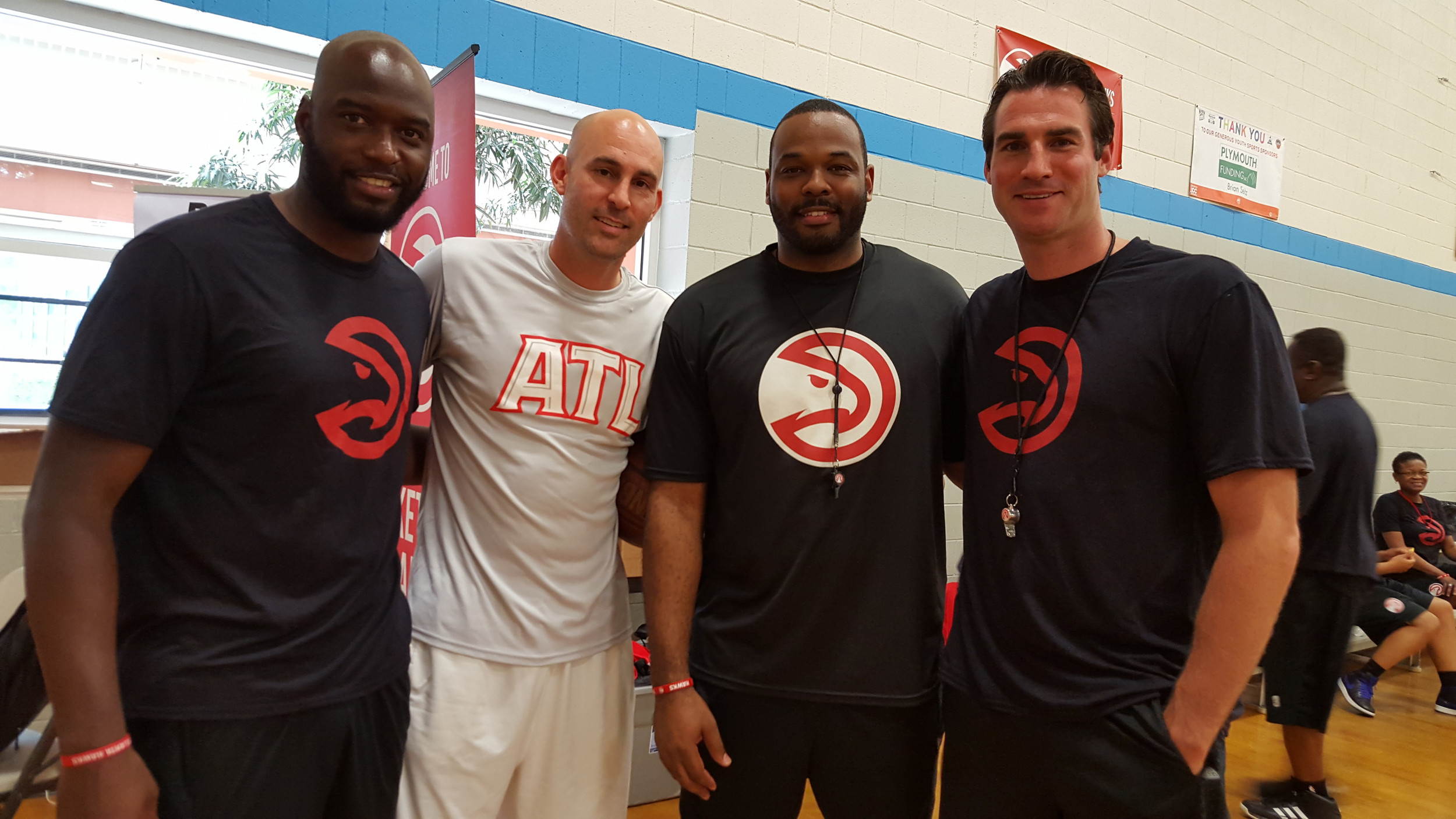 Mario West, Drew Barry, B.J. Elder and Jon Babul at a Hawks camp.