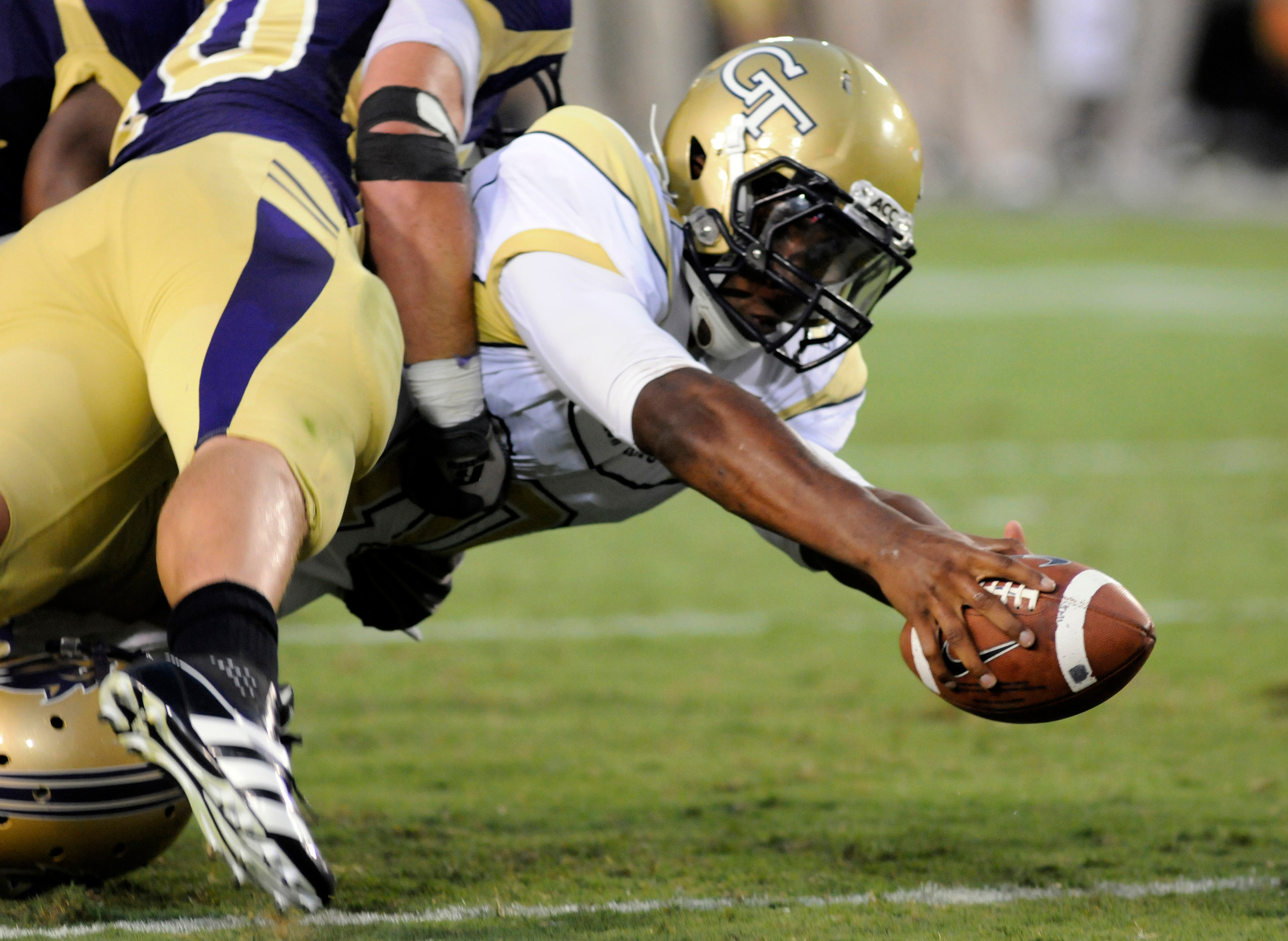 Georgia Tech quarterback Synjyn Days reaches the ball across the goal line to score a touchdown against Western Carolina during an NCAA college football in Atlanta, Thursday, Sept. 1, 2011. AP Photo/Billy Weeks)