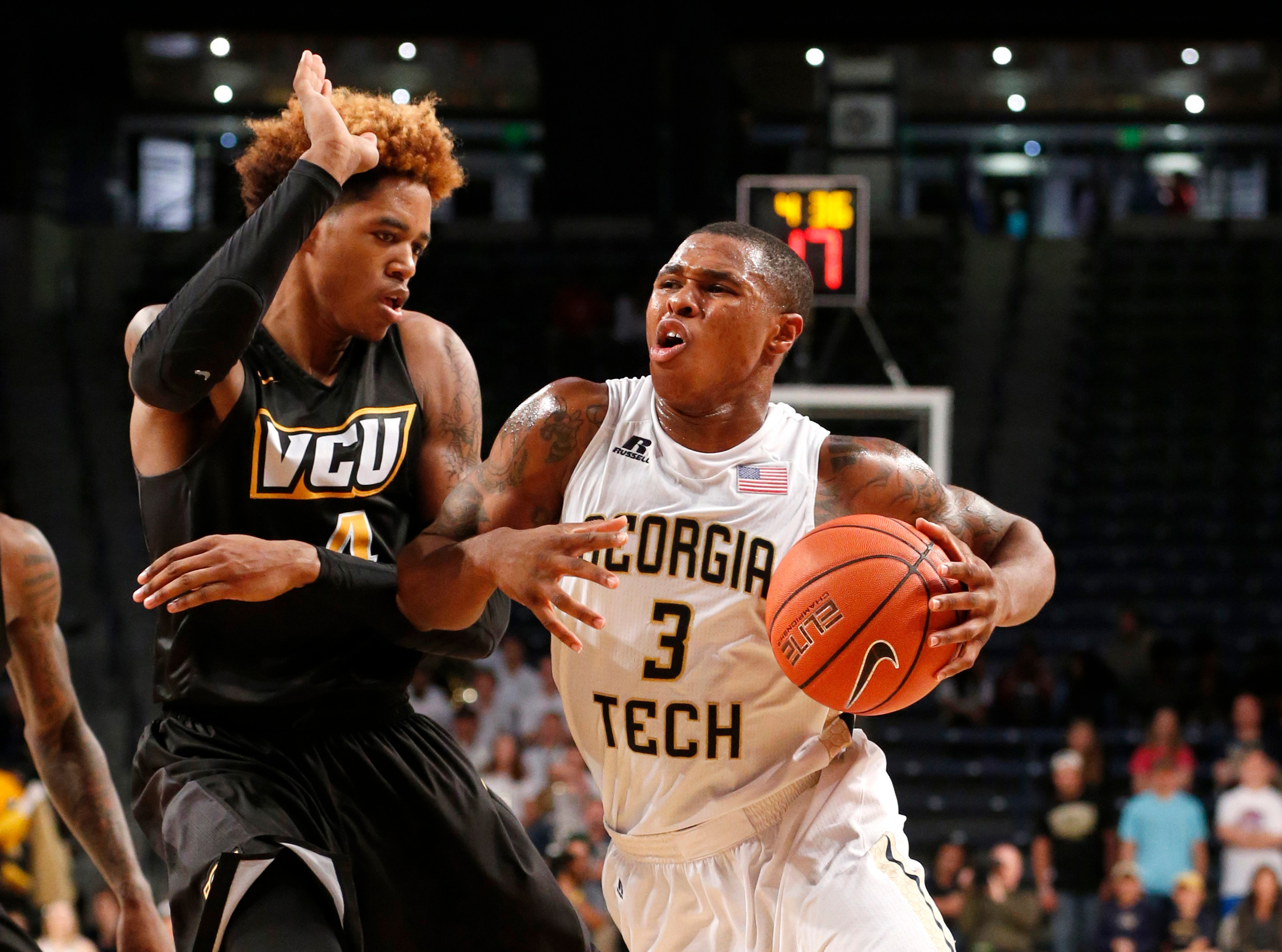 Georgia Tech guard Marcus Georges-Hunt dibbles the ball around Virginia Commonwealth Rams forward Justin Tillman in the second half of their game at McCamish Pavilion. Credit: Jason Getz-USA TODAY Sports