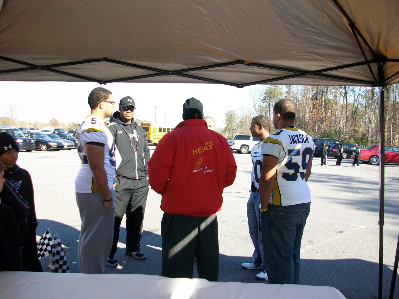 Georgia Tech football players Jason Peters, Roddy Jones and Kyle Jackson worked with local young kids Feb. 21 at the Heat Track Club Fun Run.