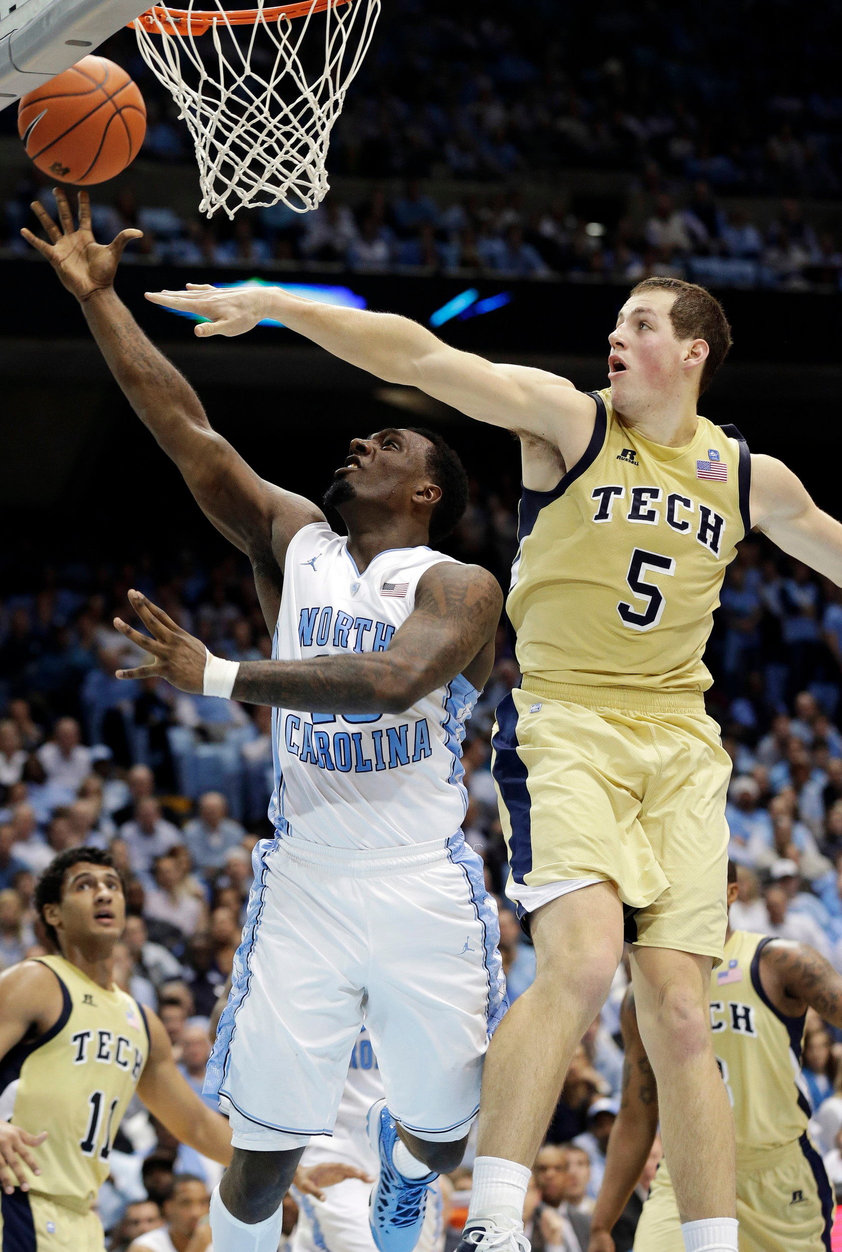 North Carolina's P.J. Hairston drives to the basket as Georgia Tech's Daniel Miller (5) defends during the second half. (AP Photo/Gerry Broome)
