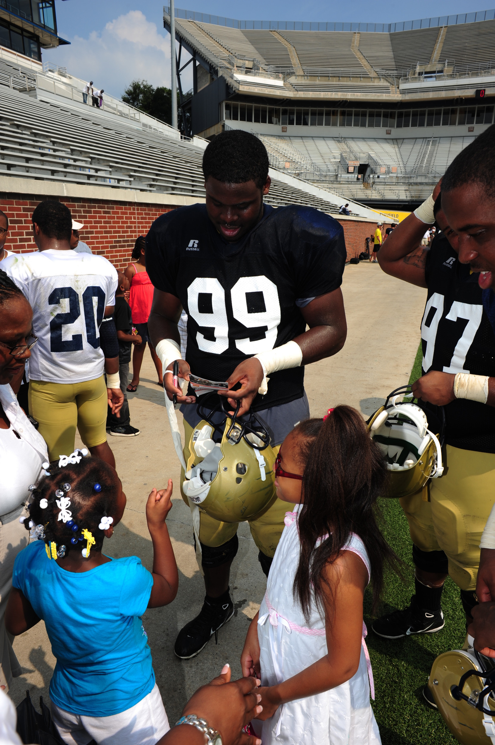 Euclid Cummings signs an autograph