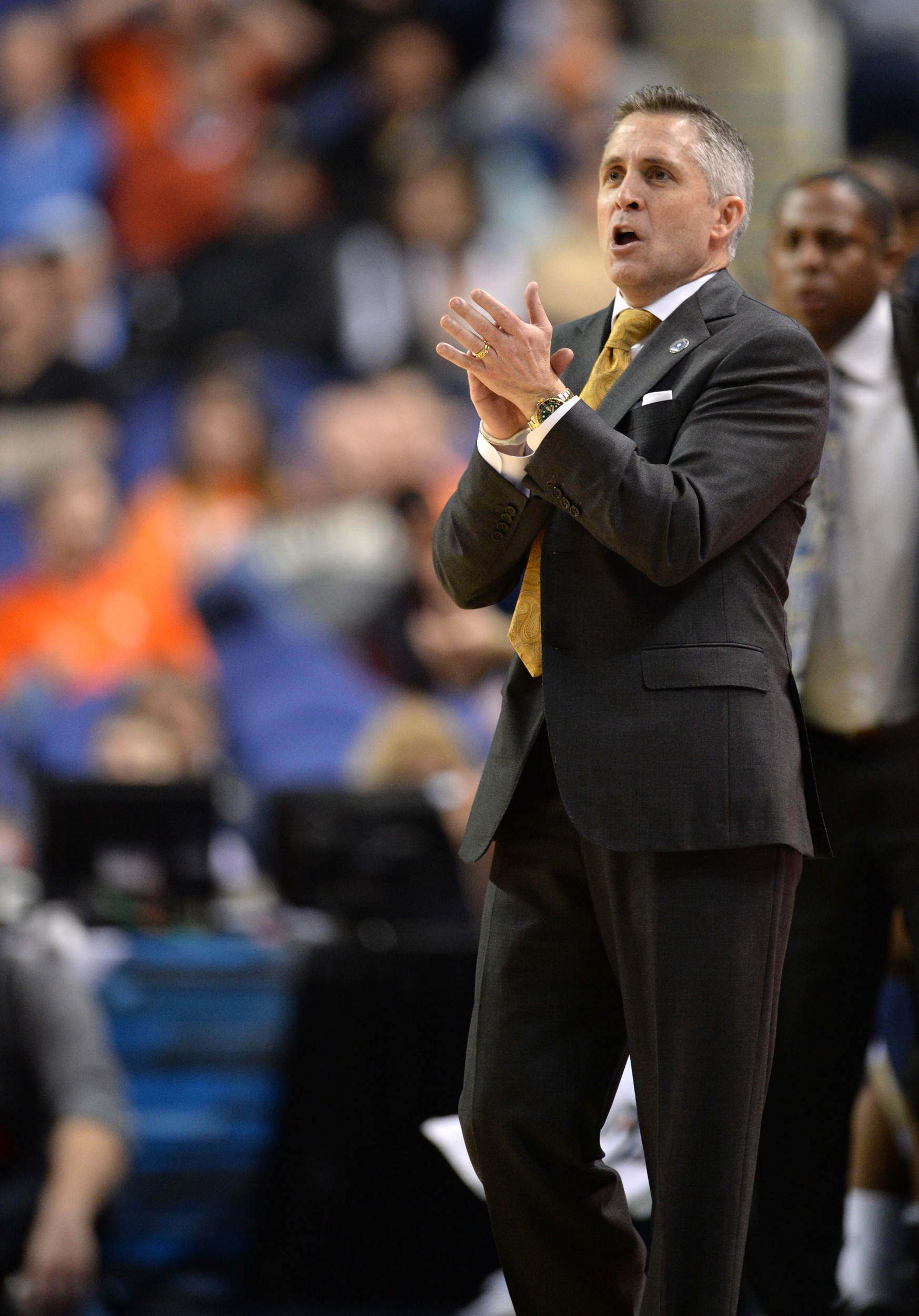 Mar 13, 2014; Greensboro, NC, USA; Georgia Tech Yellow Jackets head coach Brian Gregory cheers his players on from the baseline against the Clemson Tigers in the second round of the ACC college basketball tournament at Greensboro Coliseum. Mandatory Credit: John David Mercer-USA TODAY Sports