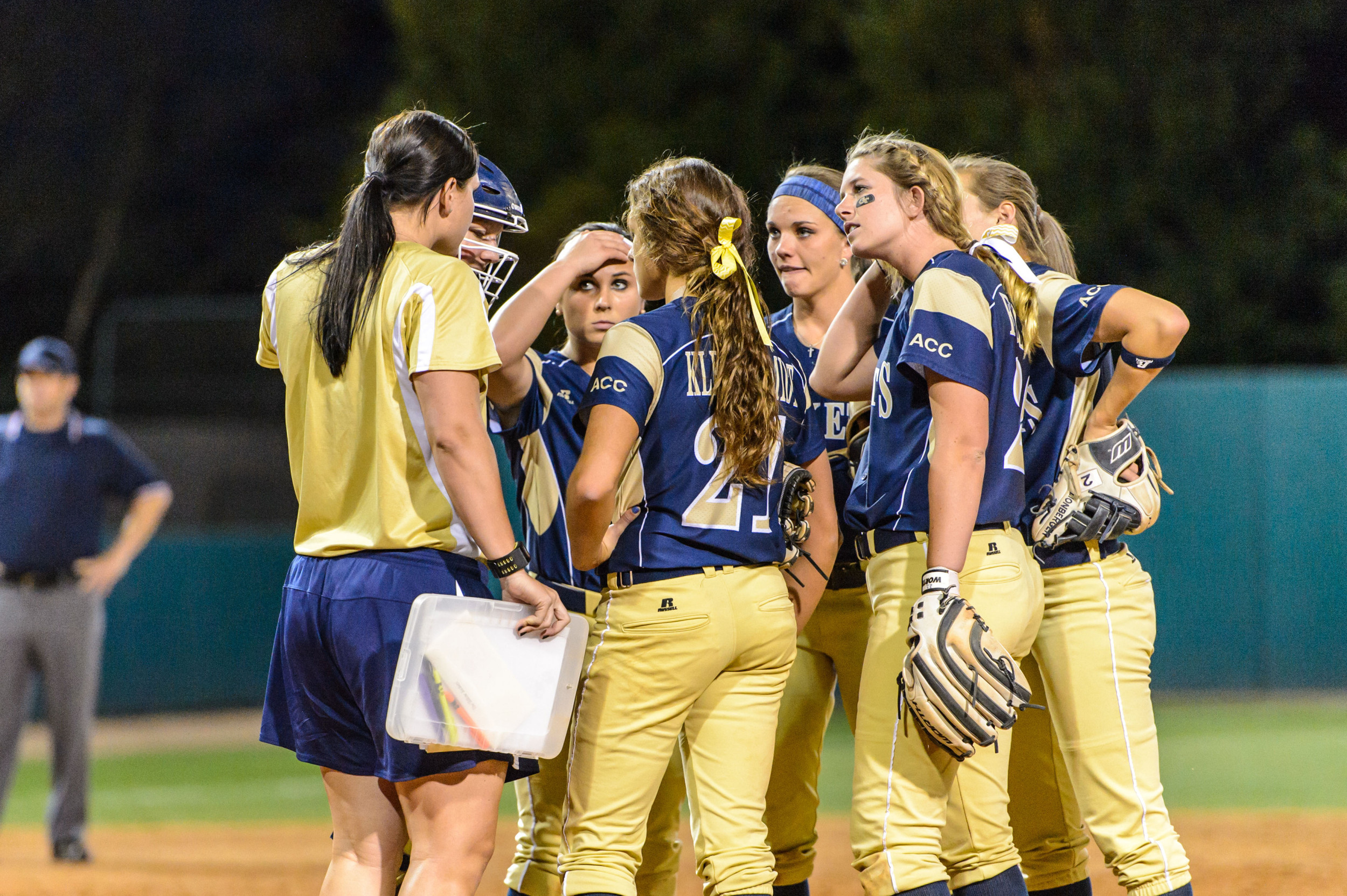 Assistant Coach Charlotte Morgan speaks to the infield