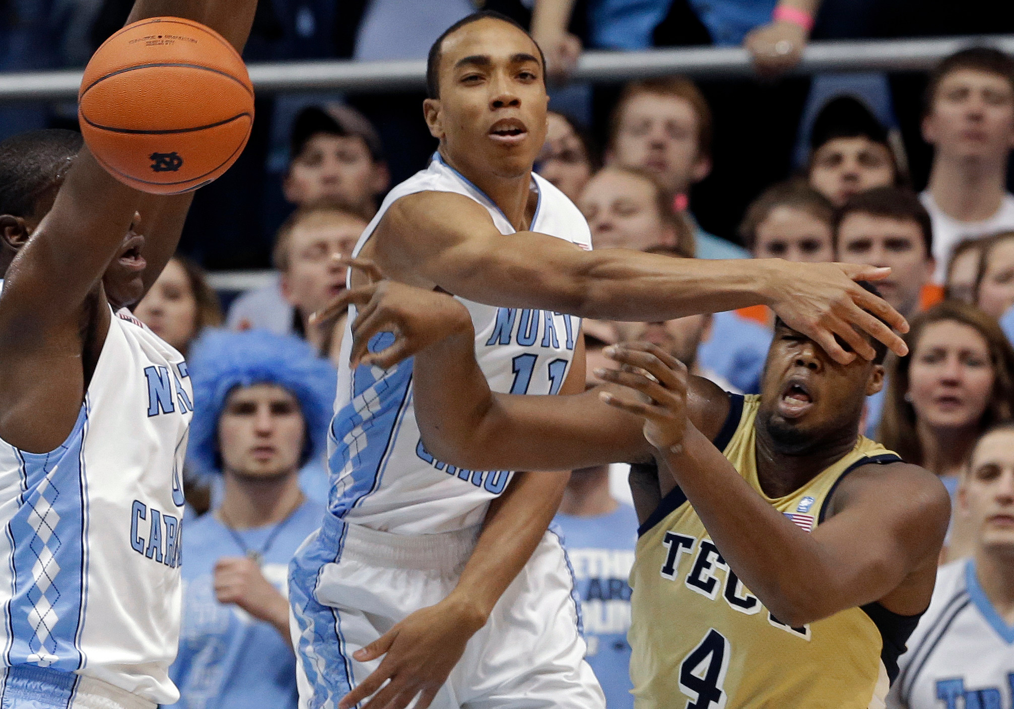 North Carolina's Brice Johnson hits Georgia Tech's Robert Carter (4) in the face during the first half. (AP Photo/Gerry Broome)