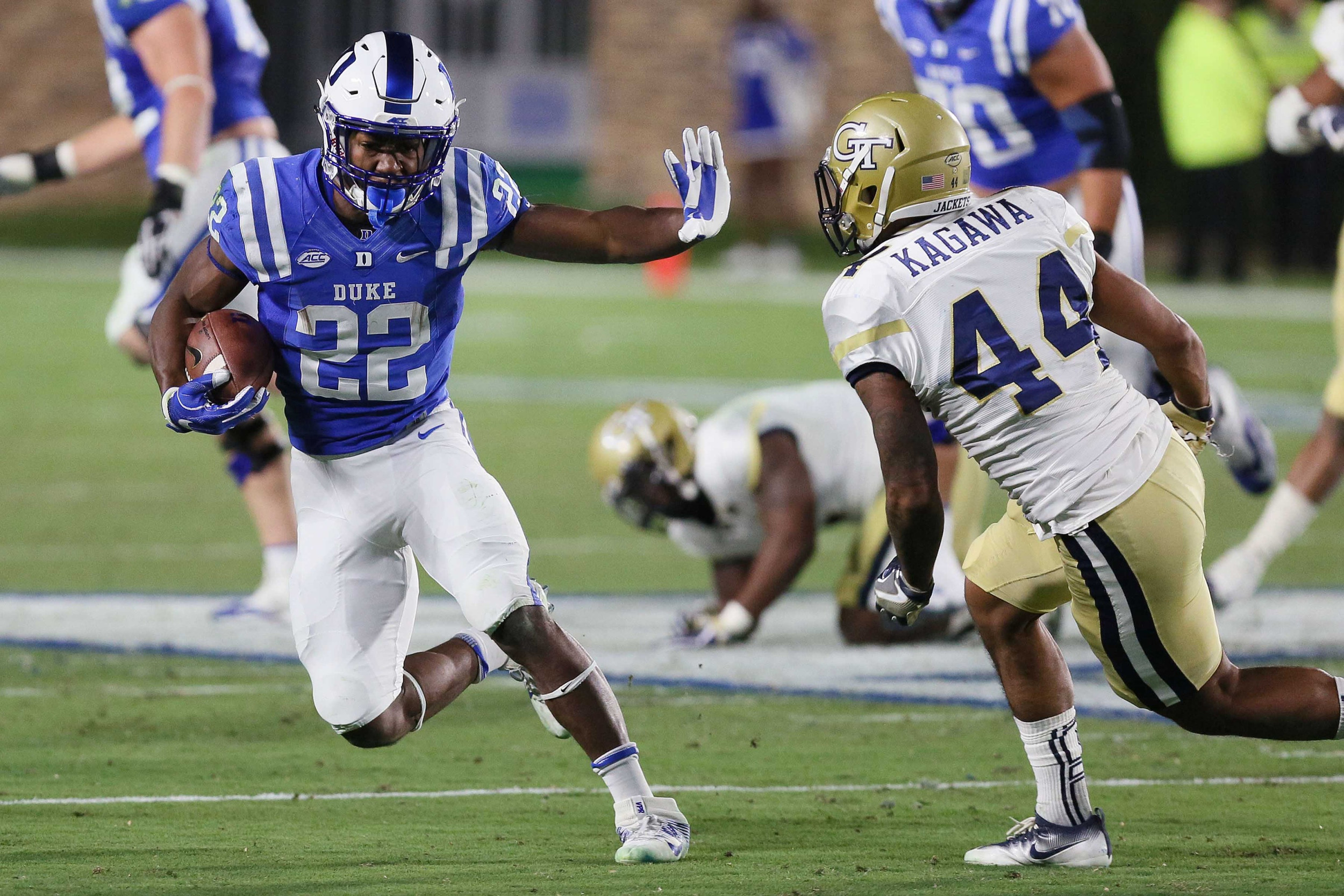 Nov 18, 2017; Durham, NC, USA; Duke Blue Devils running back Brittain Brown (22) runs against Georgia Tech Yellow Jackets defensive back Shaun Kagawa (44) in the second half at Wallace Wade Stadium. Duke beat the Georgia Tech 42-20. Mandatory Credit: Mark Dolejs-USA TODAY Sports