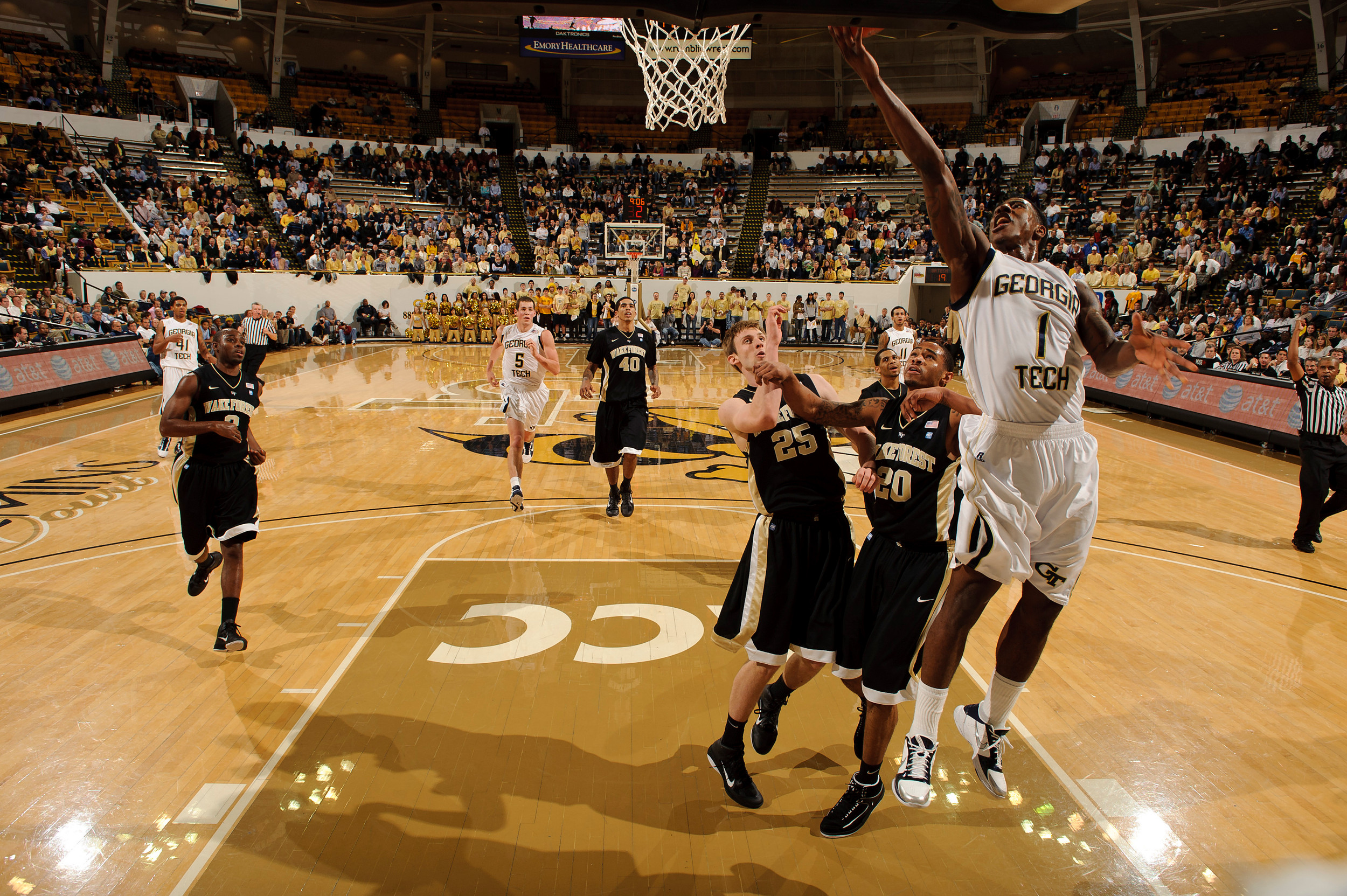 Jan 19, 2011; Atlanta, GA, USA; Georgia Tech Yellow Jackets guard Iman Shumpert (1) drives to the basket against Wake Forest Demon Deacons forward Nikita Mescheriakov (25) and forward Ari Stewart (20) during the first half at Alexander Memorial Coliseum. Georgia Tech defeated Wake Forest 74-39. Mandatory Credit: Paul Abell-US PRESSWIRE
