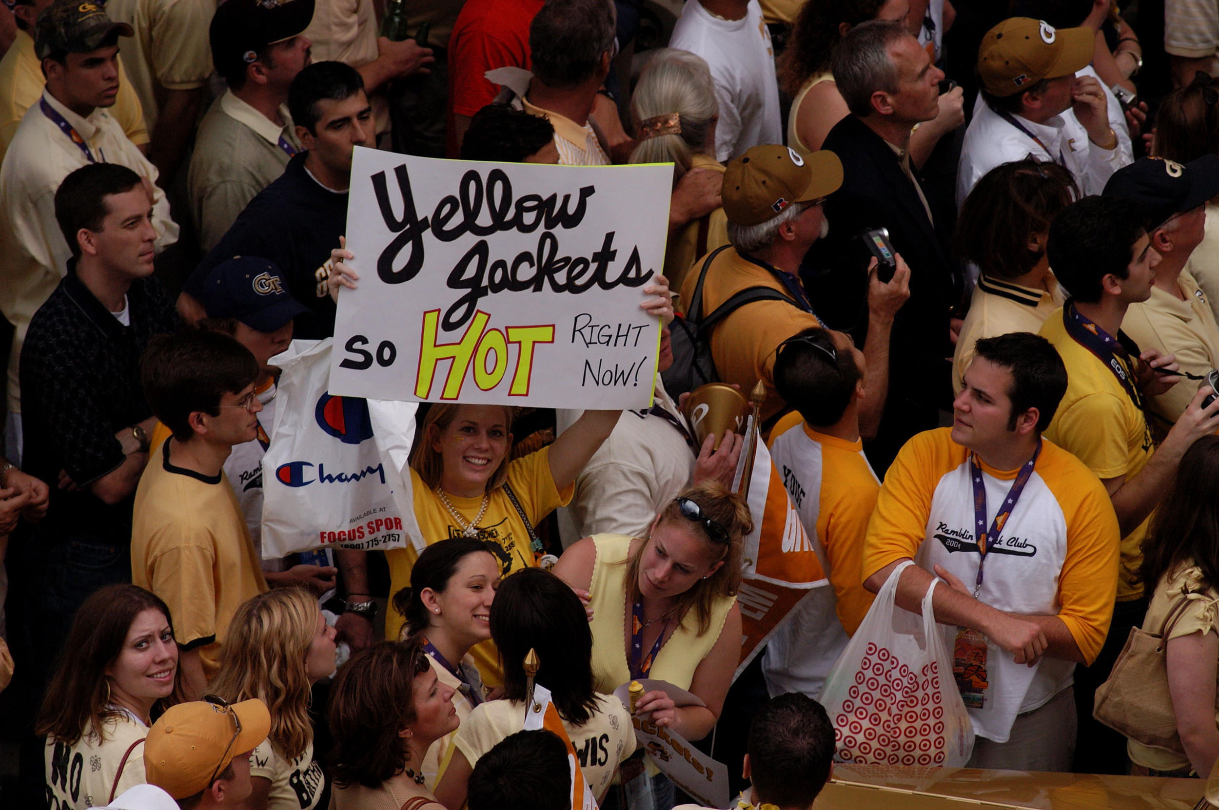 Tech fans crowd the bus as it prepares to leave the team hotel at the 2004 Final Four in San Antonio.