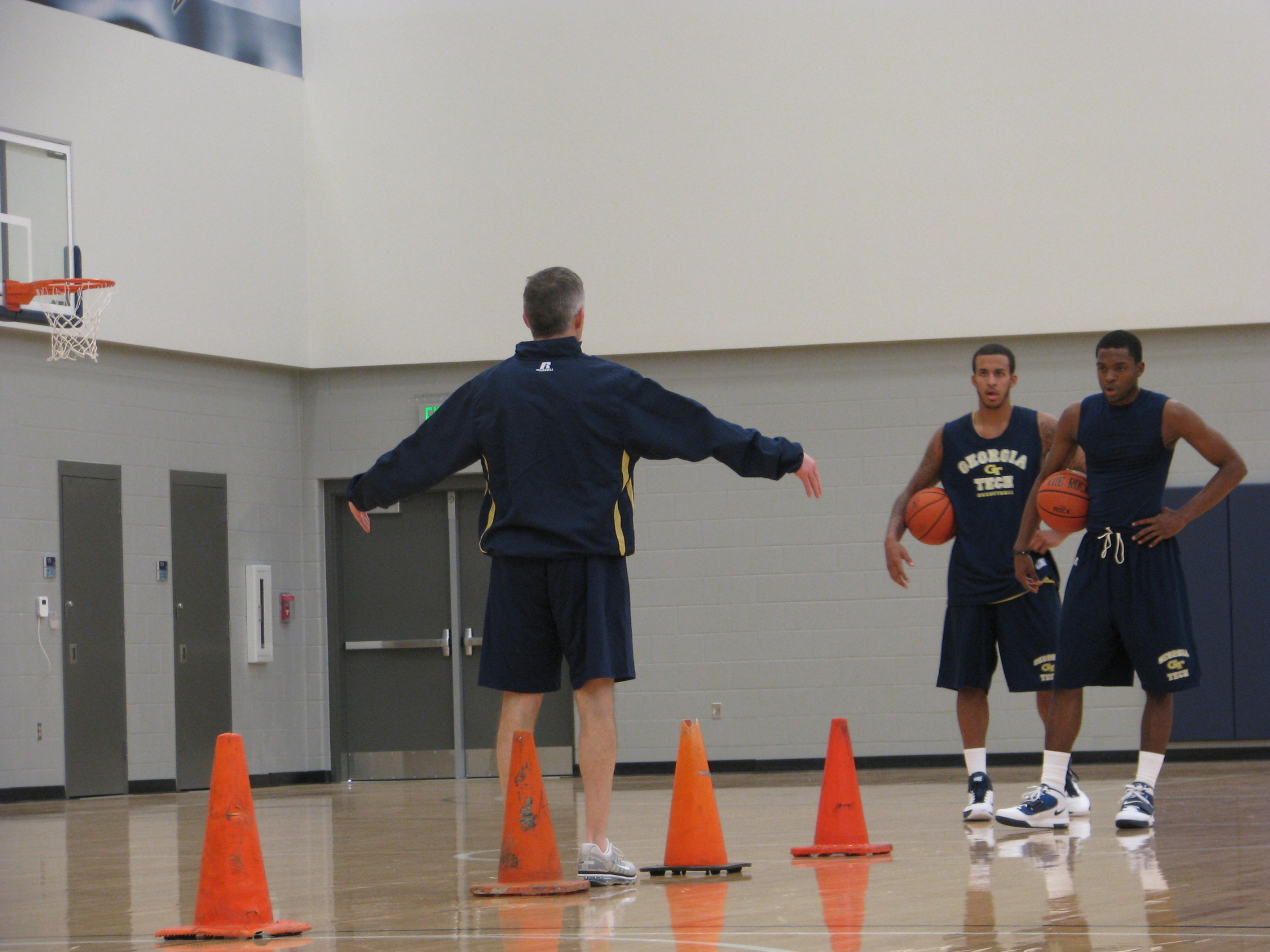 Head coach Brian Gregory puts the Yellow Jackets through individual workouts.