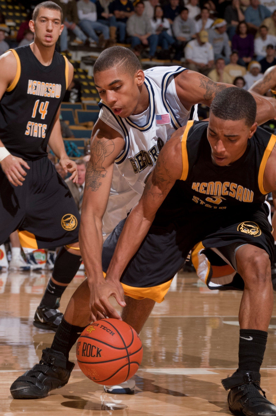 Georgia Tech's guard Glen Rice Jr. (41) vies for a loose ball against Kennesaw State's guard Spencer Dixon (5) during the second half of an NCAA college basketball game at Alexander Memorial Coliseum on Tuesday, Dec. 22, 2009 in Atlanta. Georgia Tech won 80-55. (AP Photo/Stanley Leary)