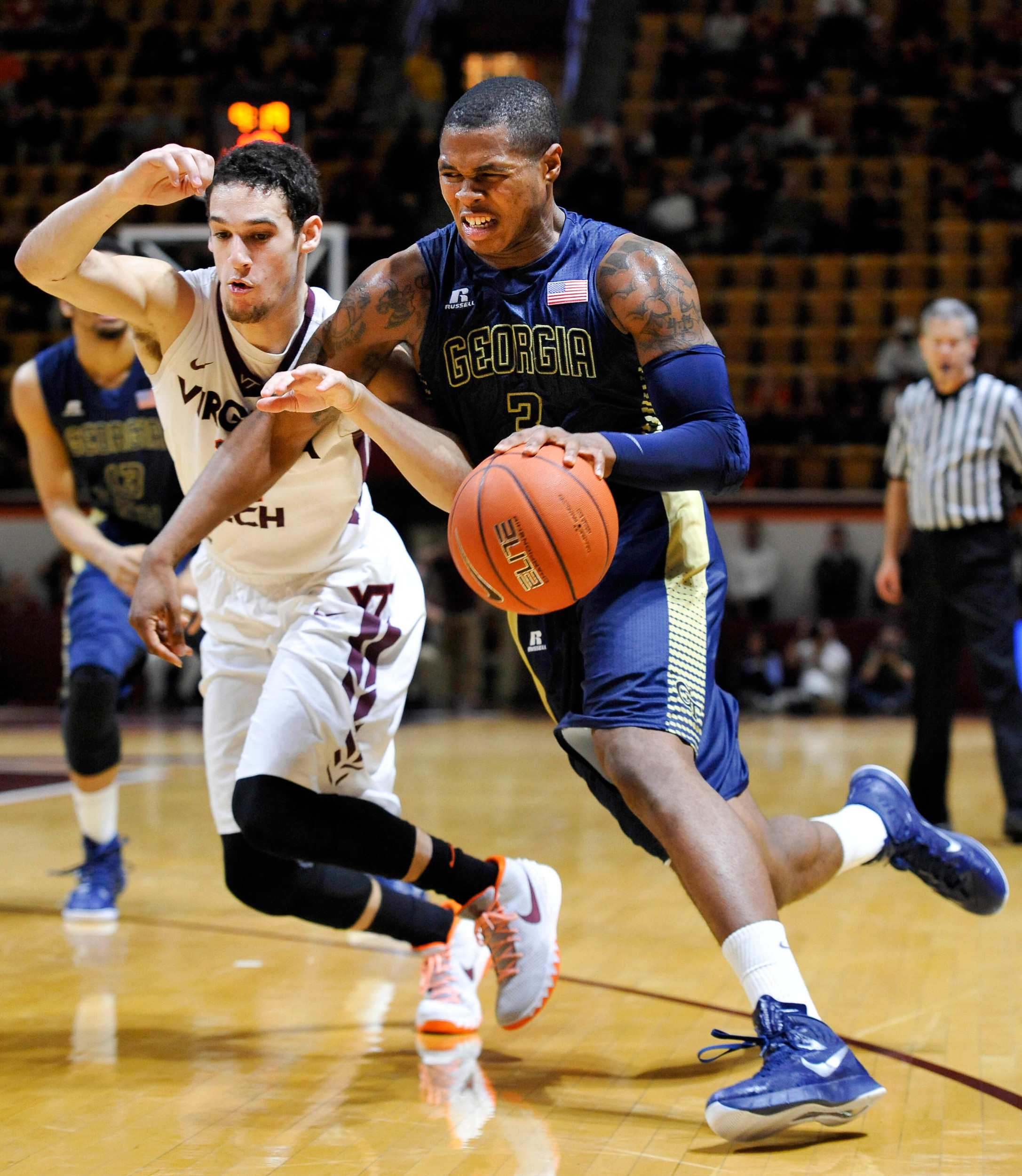 Feb 9, 2015; Blacksburg, VA, USA; Georgia Tech Yellow Jackets forward Marcus Georges-Hunt (3) drives past Virginia Tech Hokies guard Devin Wilson (11) in the second half at Cassell Coliseum. Virginia Tech defeated Georgia Tech 65-63. Mandatory Credit: Michael Shroyer-USA TODAY Sports
