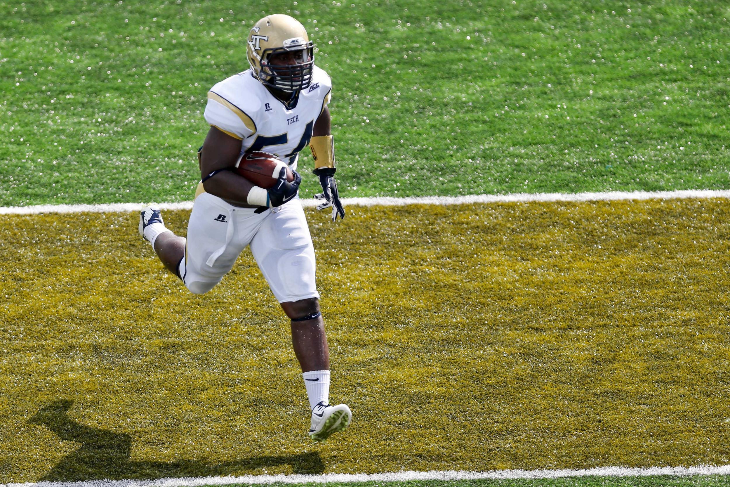 Georgia Tech Yellow Jackets linebacker Quayshawn Nealy (54) returns an interception for a touchdown against the Tulane Green Wave during the first half of a game at Yulman Stadium. Derick E. Hingle-USA TODAY Sports