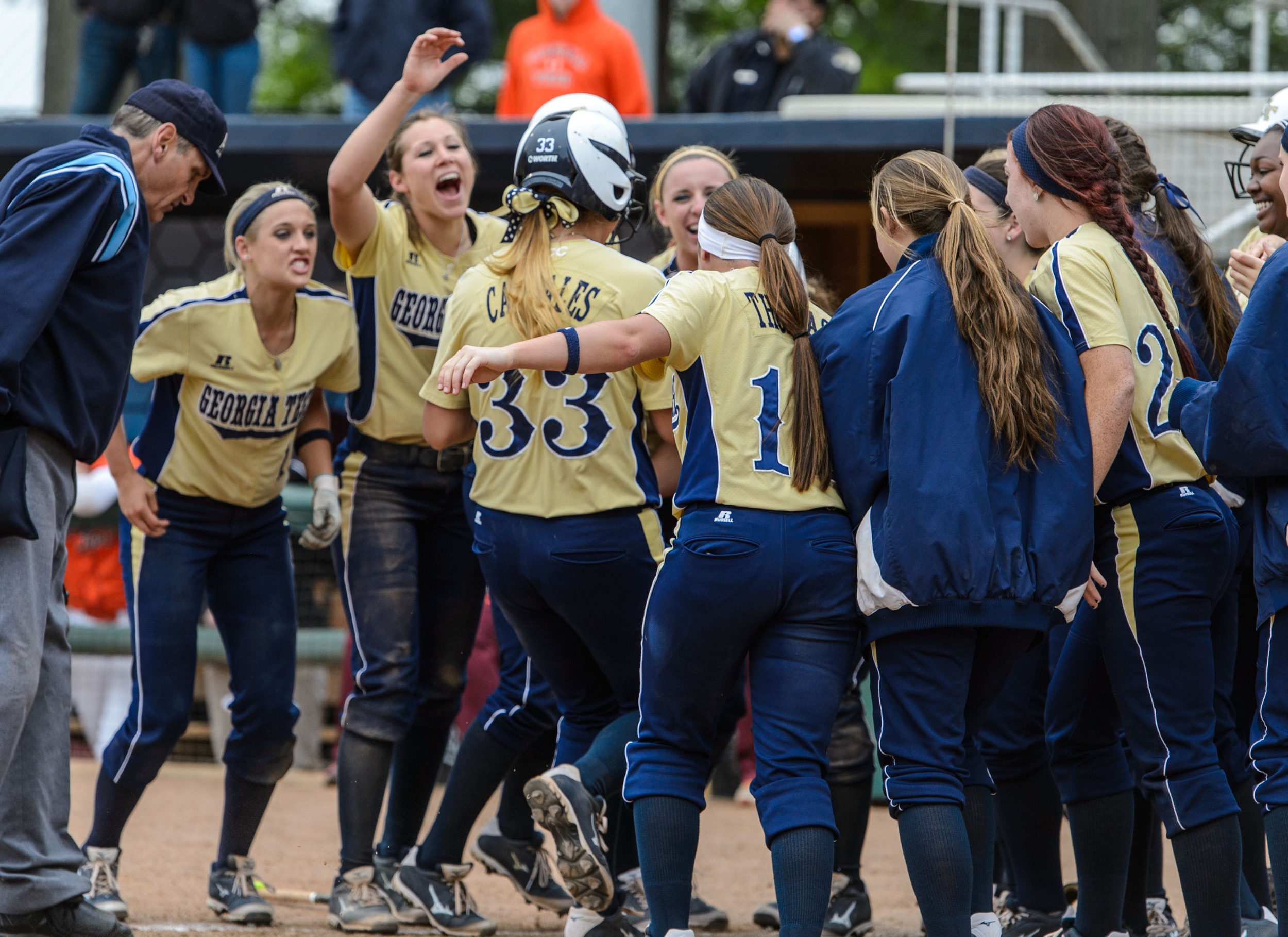 The team congratulates Kanani Cabrales (33) after hitting her first career home run
