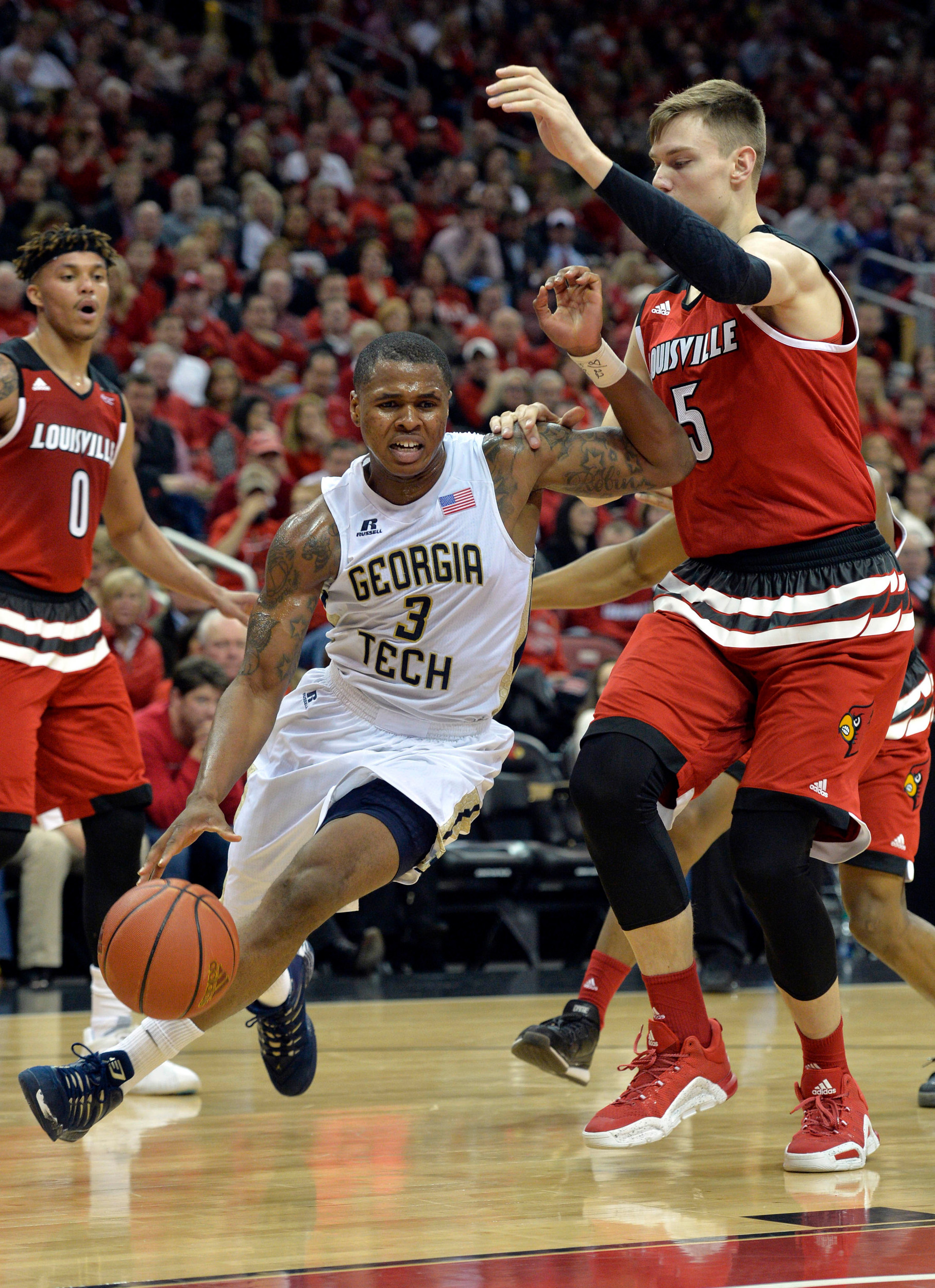 Marcus Georges-Hunt dribbles against Louisville Cardinals center Matz Stockman (5) during the first half at KFC Yum! Center. Jamie Rhodes-USA TODAY Sports