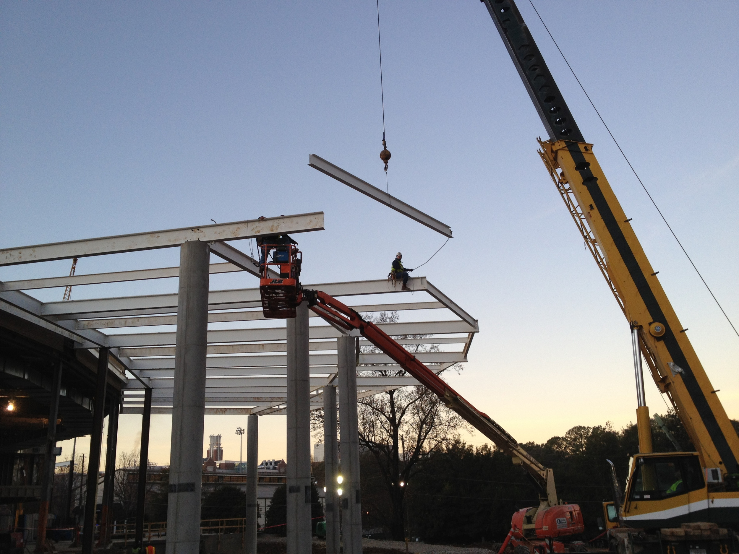 Iron Workers installing steel structure on the exterior of McCamish Pavilion - 12/2/11