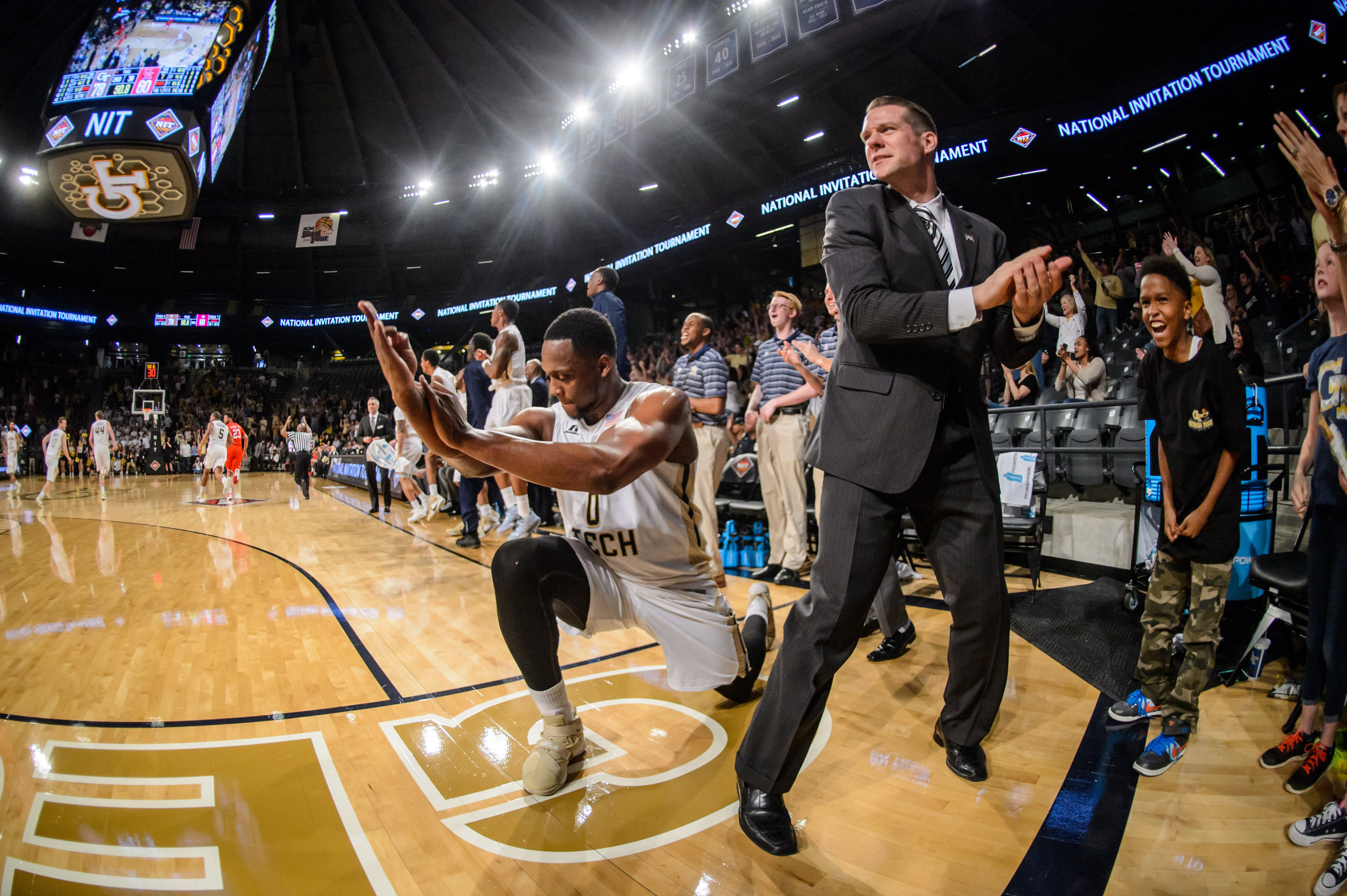 The bench reacts to Corey Heyward's three-pointer