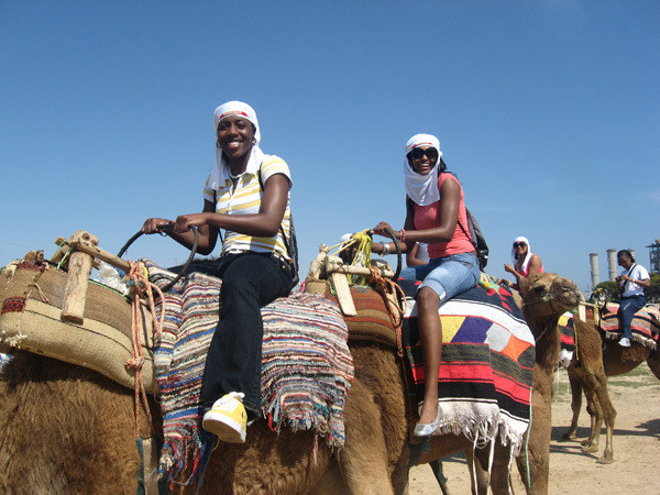 Metra Walthour and Nisha Adams on camels