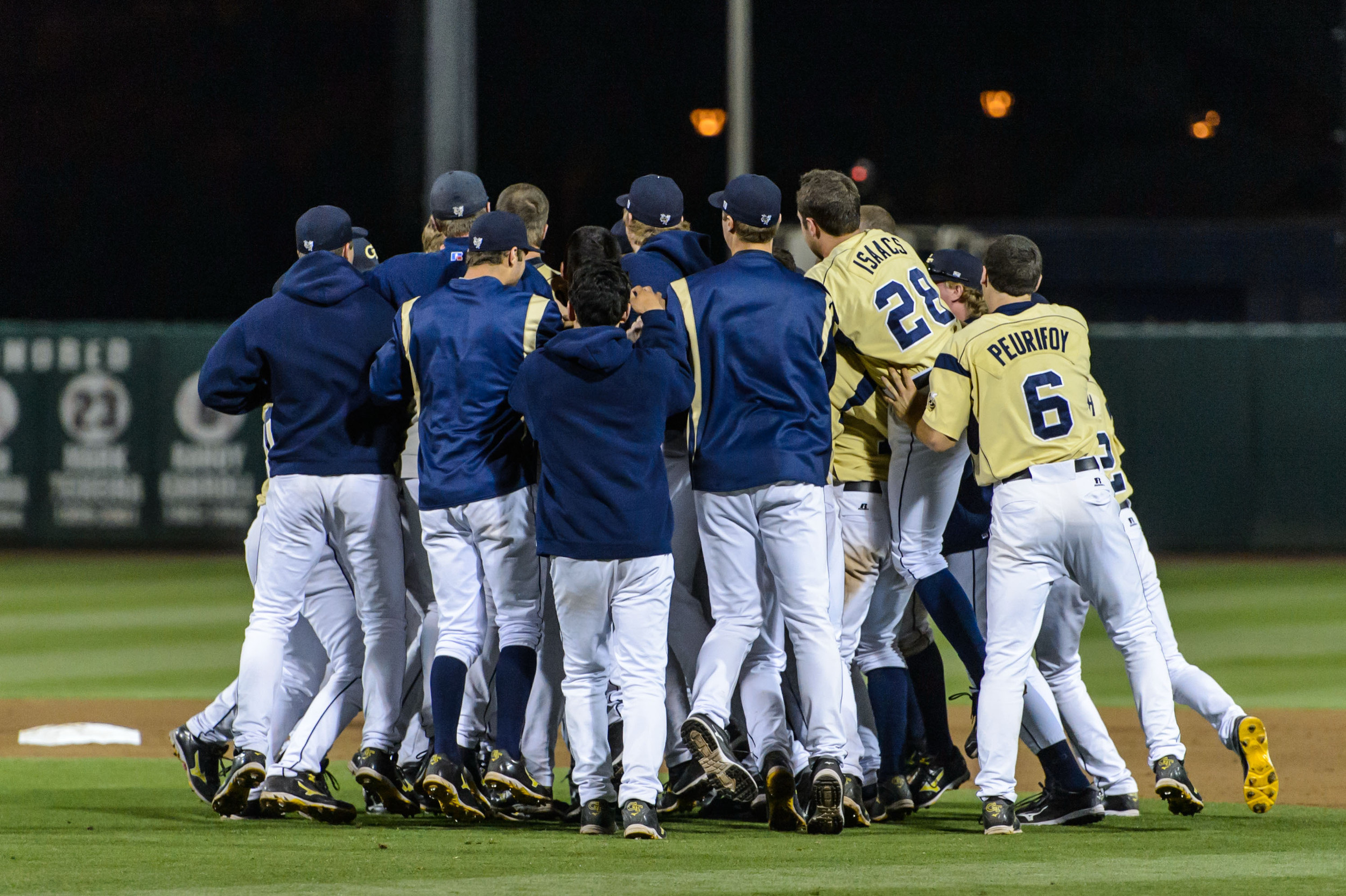 The team swarms Connor Justus after the walk-off win!