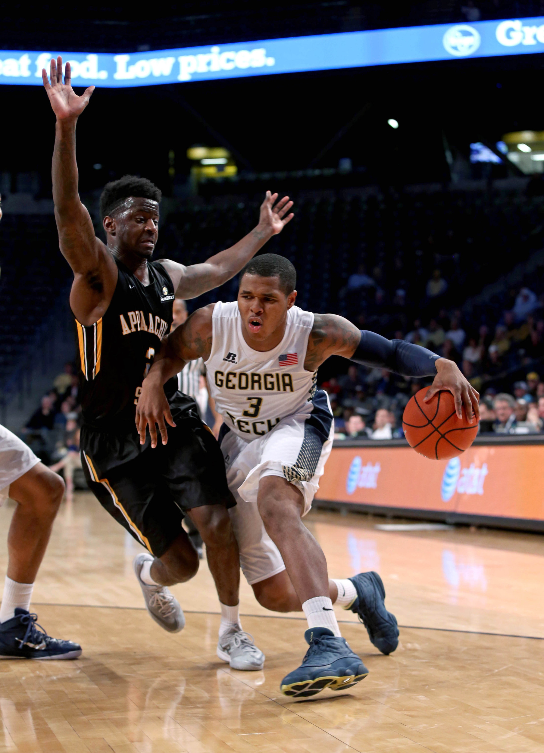 Dec 15, 2014; Atlanta, GA, USA; Georgia Tech Yellow Jackets forward Marcus Georges-Hunt (3) drives against Appalachian State Mountaineers guard Tab Hamilton (2) in the second half of their game at McCamish Pavilion. Georgia Tech won 70-57. Mandatory Credit: Jason Getz-USA TODAY Sports