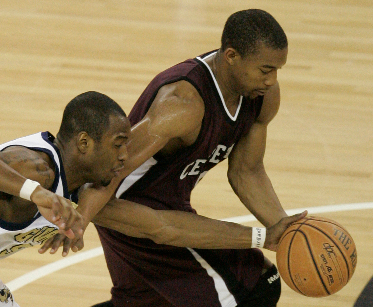Georgia Tech's Mario West, left, tries to strip the ball from Centenary's Tyrone Hamilton during the first half of a college basketball game Monday, Dec. 18, 2006, in Atlanta, Ga. (AP Photo/Todd Bennett)