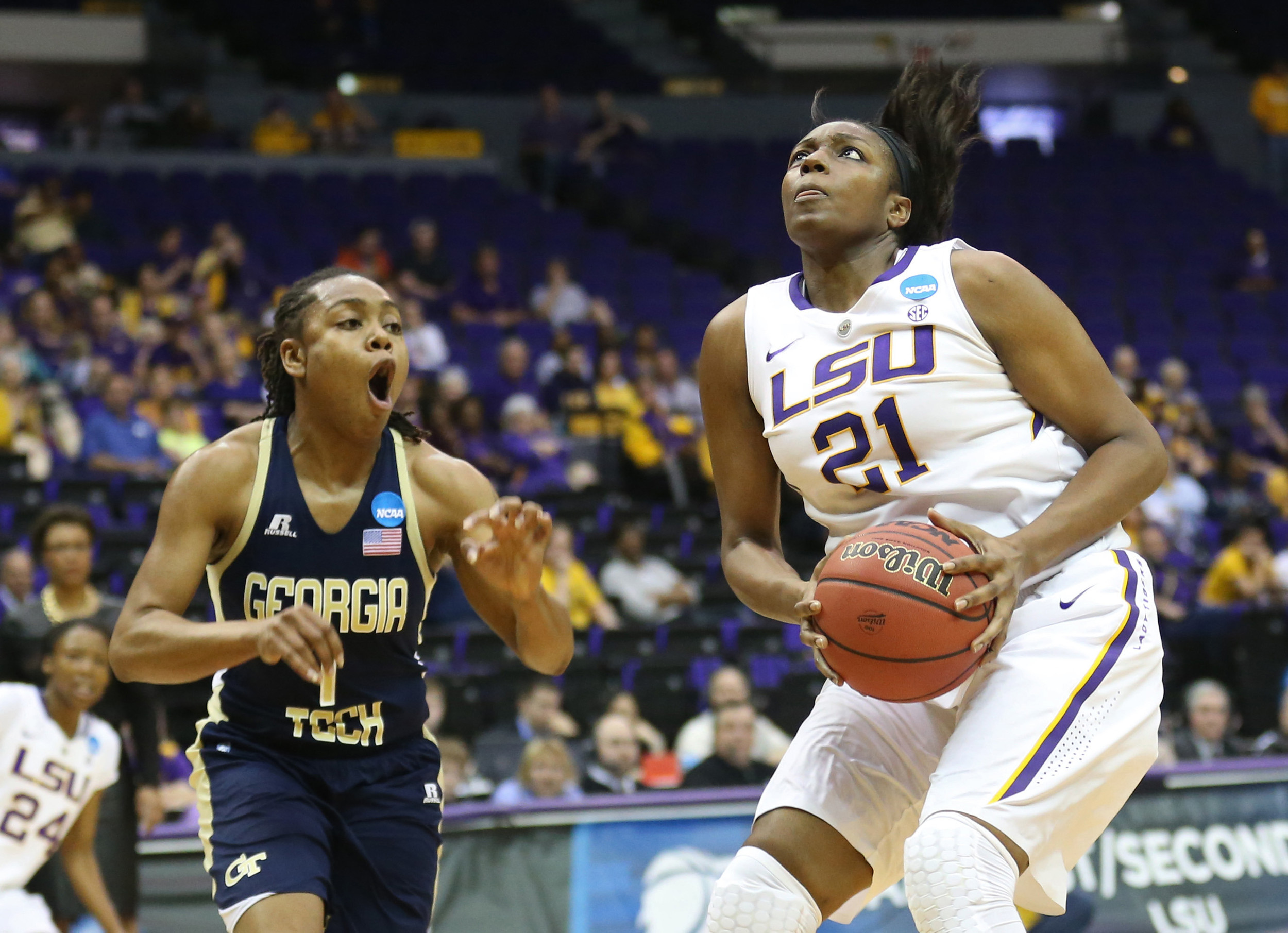 Mar 23, 2014; Baton Rouge, LA, USA; LSU Tigers forward Shanece McKinney (21) goes up for a basket beside Georgia Tech Yellow Jackets guard Dawnn Maye (1) in the second half of a women's college basketball game in the first round of the NCAA Tournament at the Pete Maravich Assembly Center. LSU defeated Georgia Tech 98-78. Mandatory Credit: Crystal LoGiudice-USA TODAY Sports