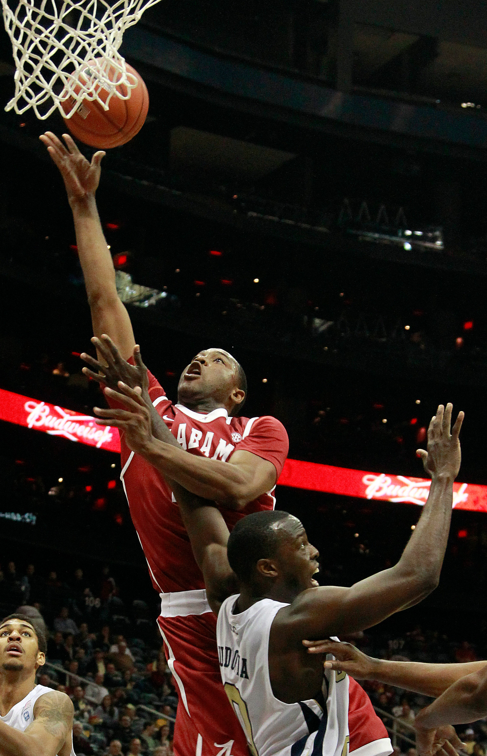 Alabama guard Andrew Steele (22) goes up for a basket as Georgia Tech guard Mfon Udofia (0) defends in the second in half of an NCAA college basketball game in Atlanta, Tuesday, Jan. 3, 2012. (AP Photo/John Bazemore)